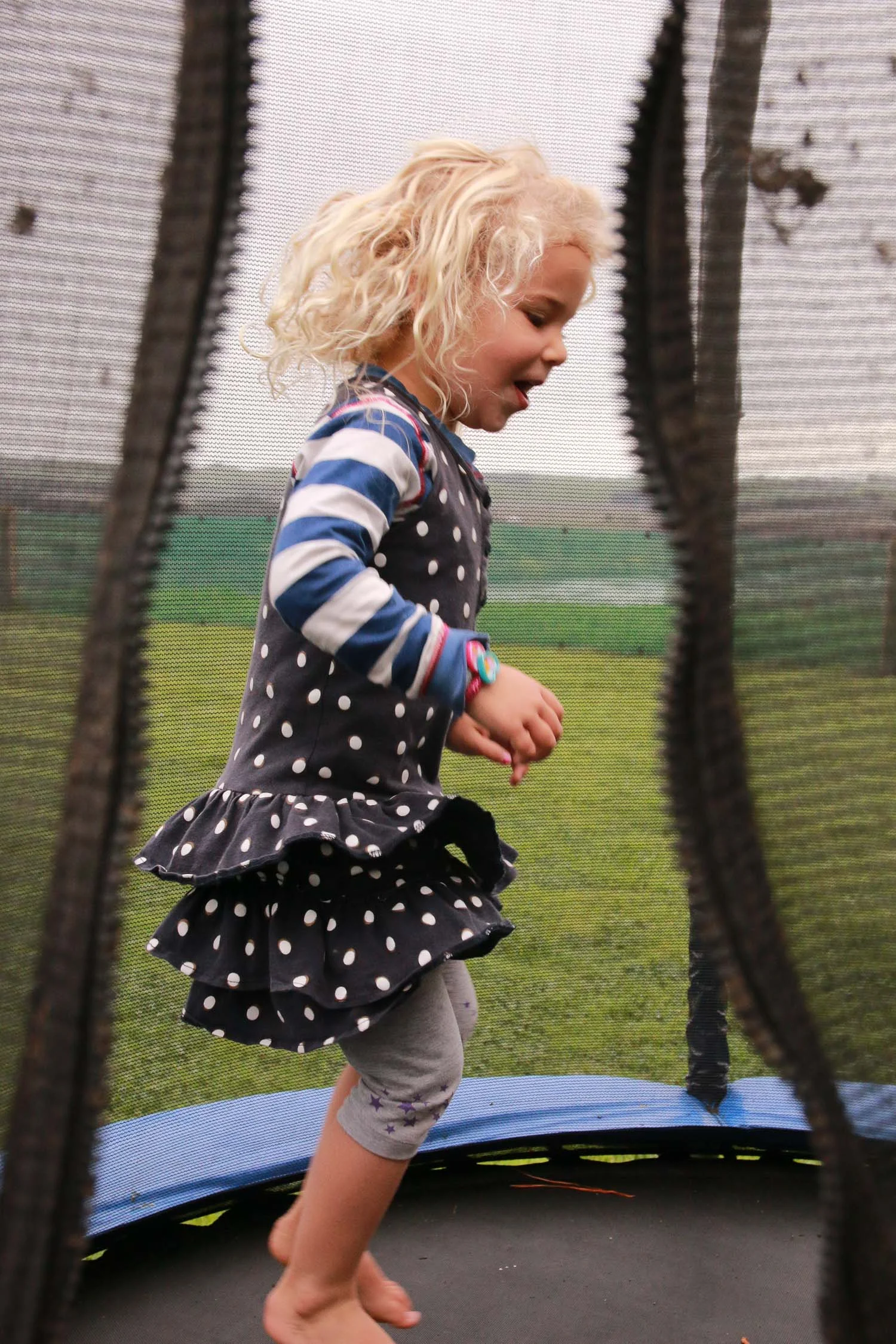 blonde-girl-jumping-on-trampoline-wearing-dress.jpg