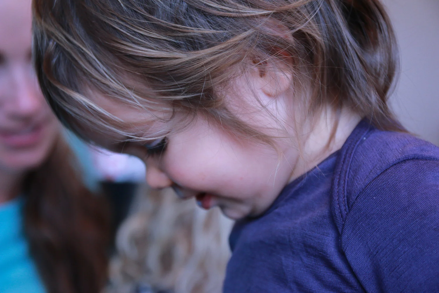 little-girl-wearing-purple-with-brown-hair-smiling.jpg