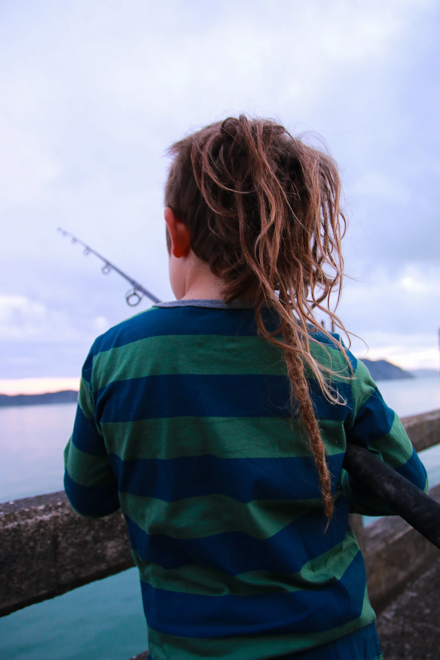 klittle boy fishing off Tolaga Bay Wharf