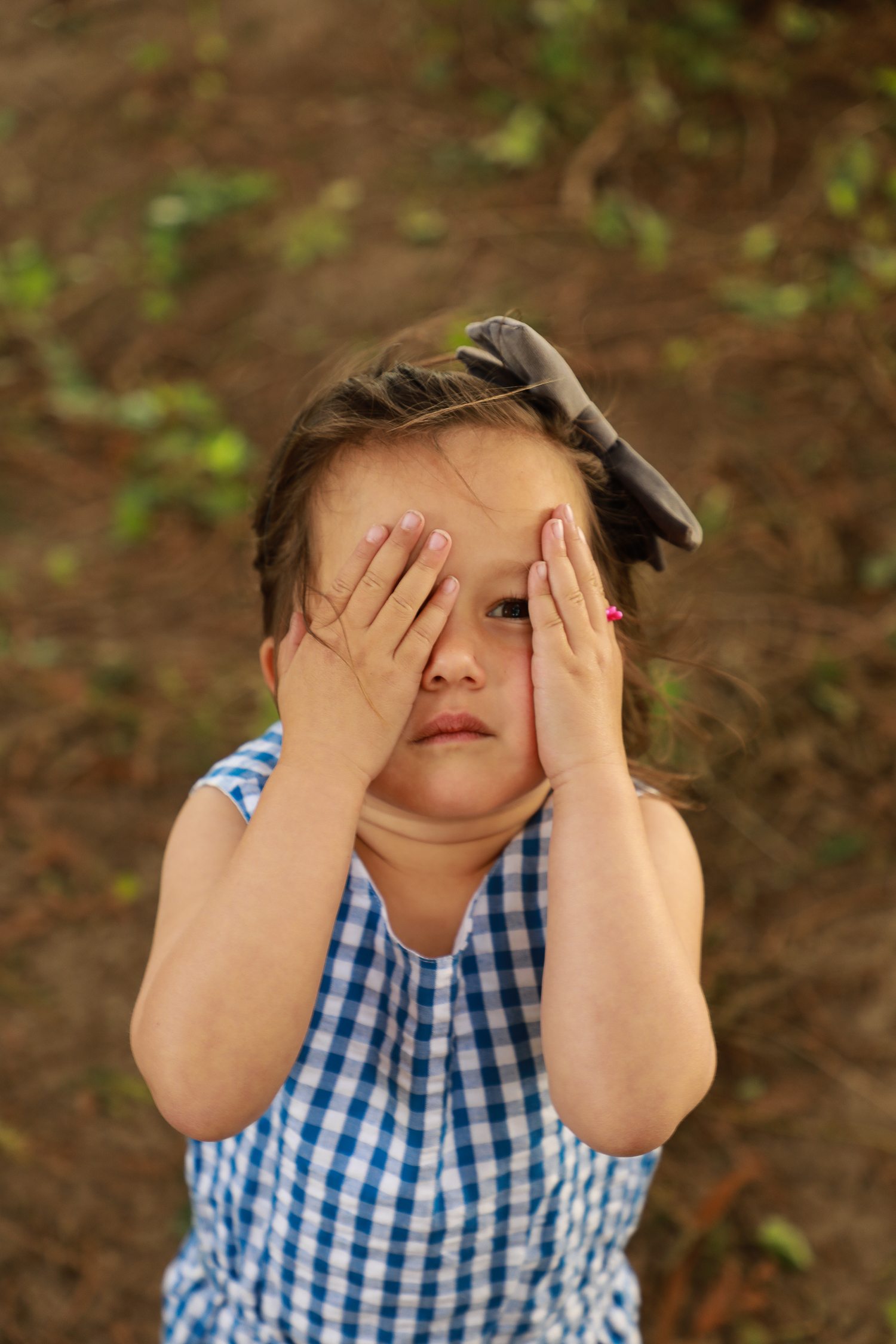 little girl playing in the forest