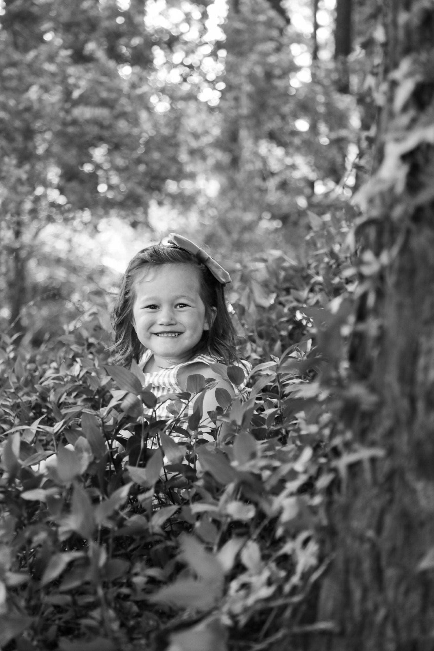 little girl playing in the forest