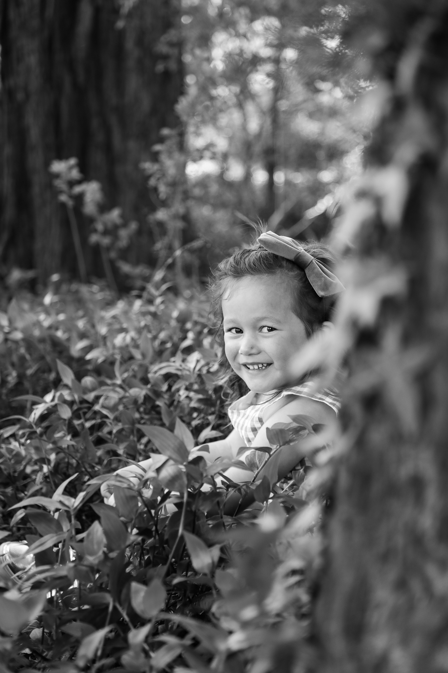 little girl playing in the forest