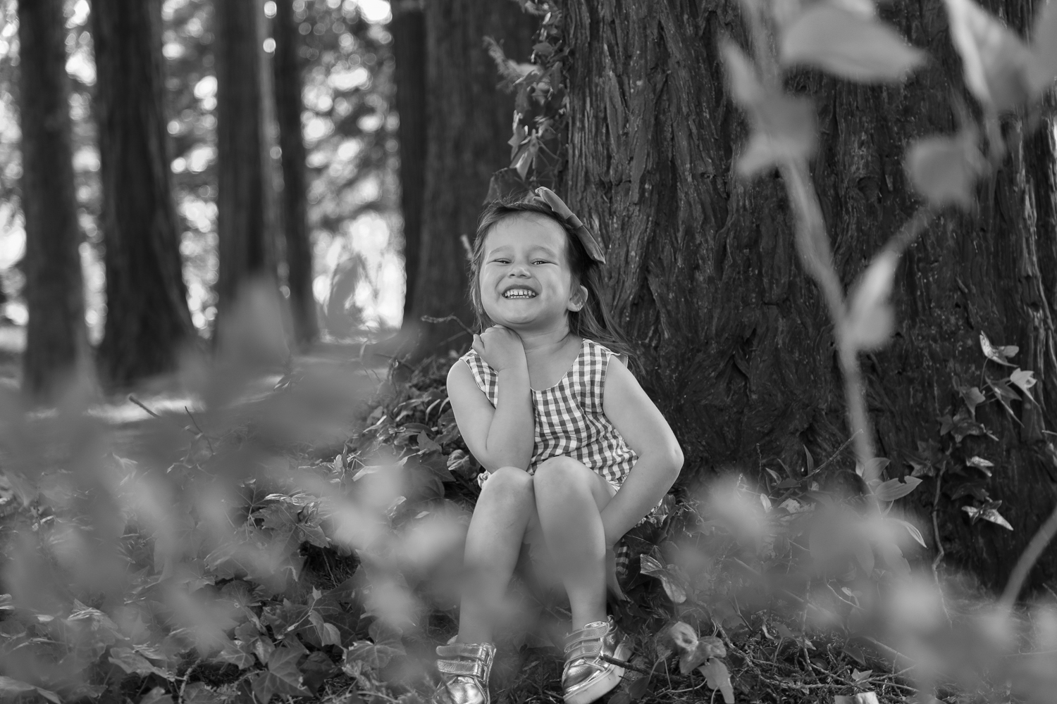 little girl playing in the forest