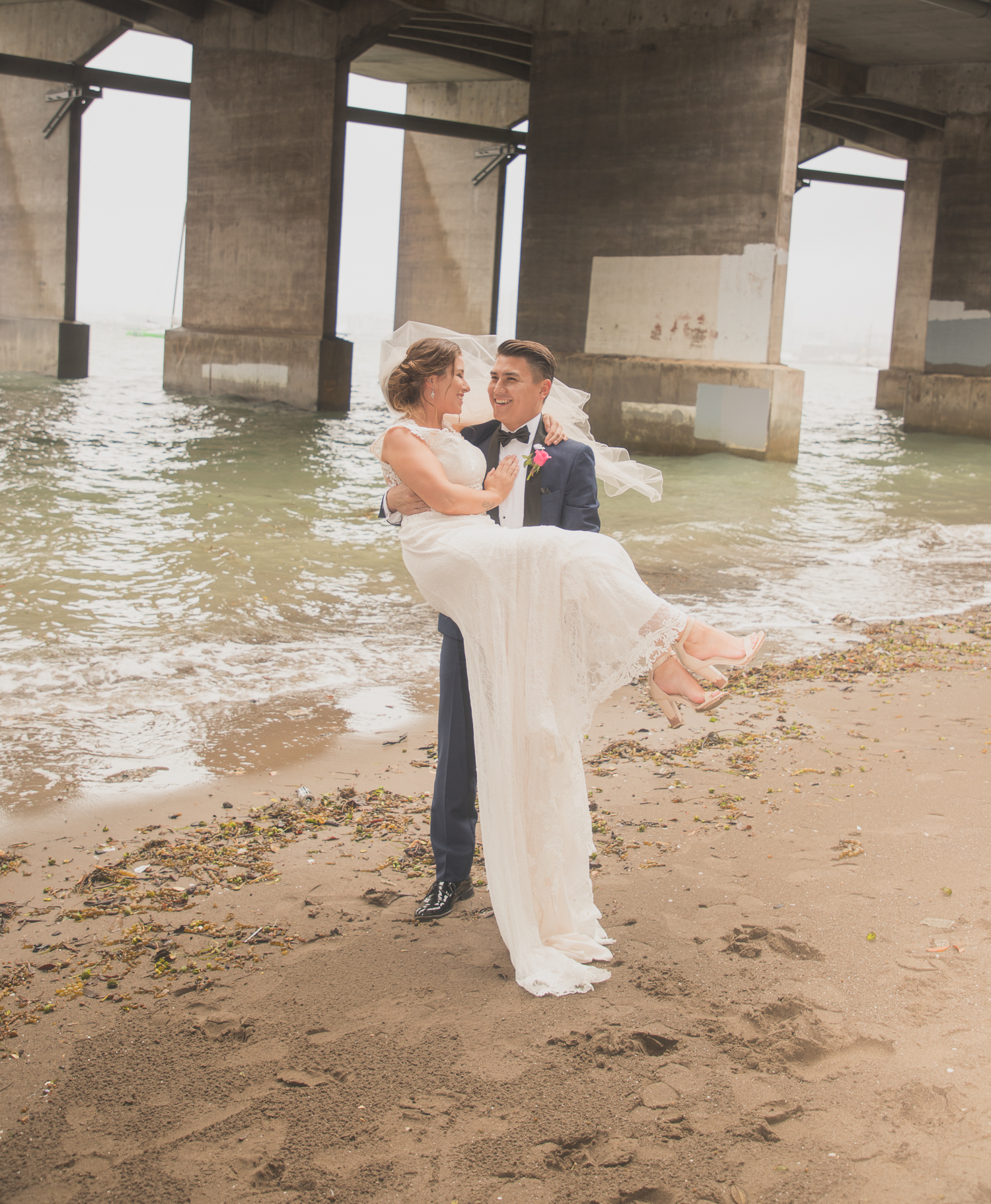 bride and groom at the beach