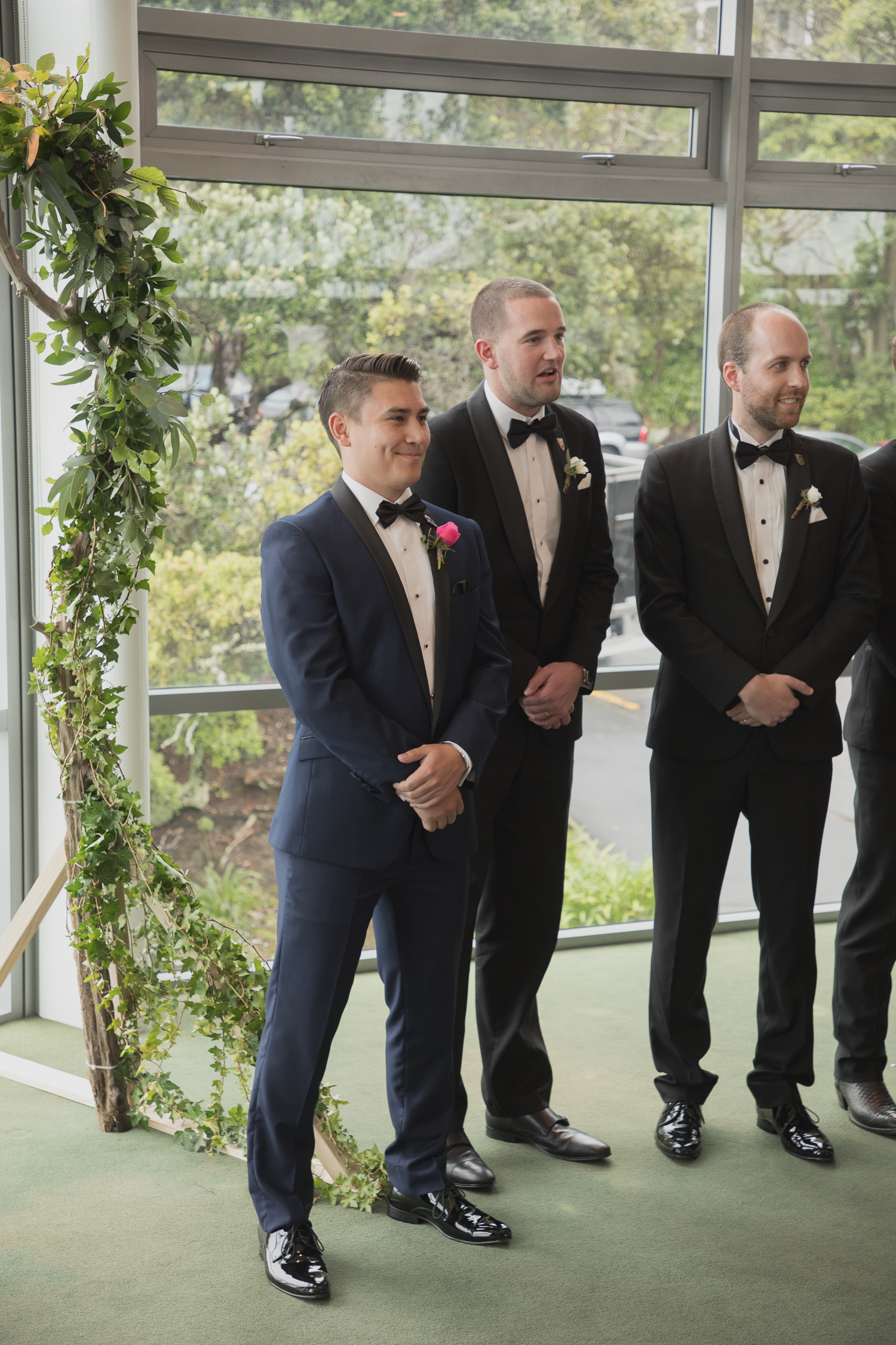 groom waiting for bride at alter