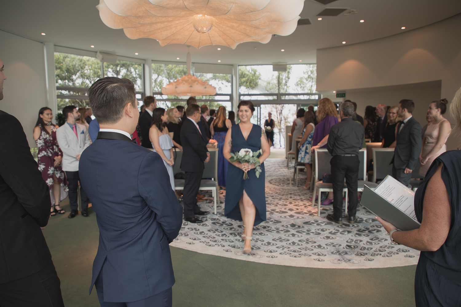 bridesmaid arriving at wedding ceremony
