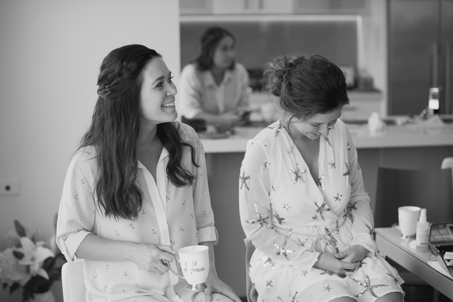 maid of honour and bride together getting ready