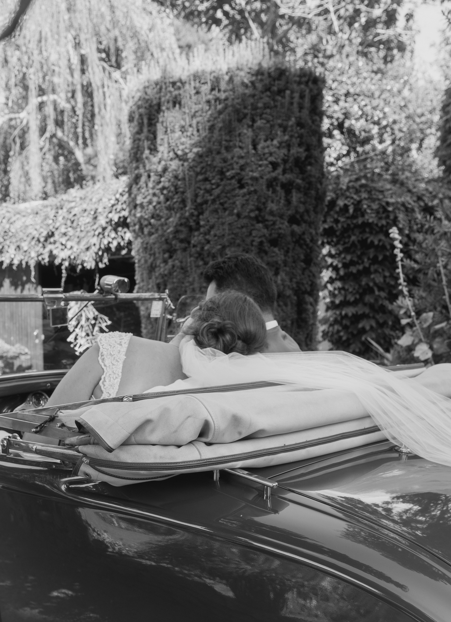 bride and groom in wedding car