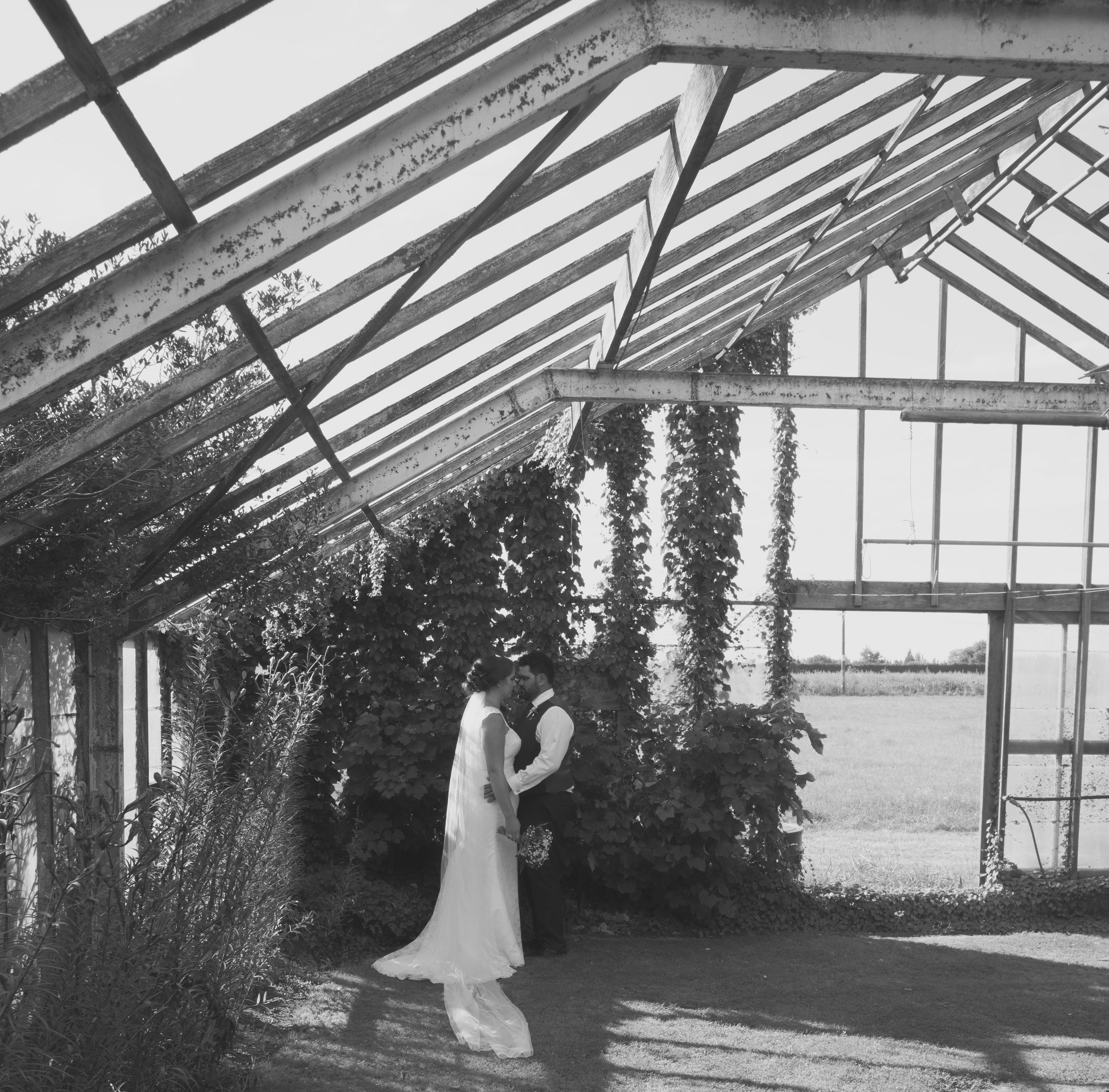 bride and groom in abandoned glasshouse on wedding day