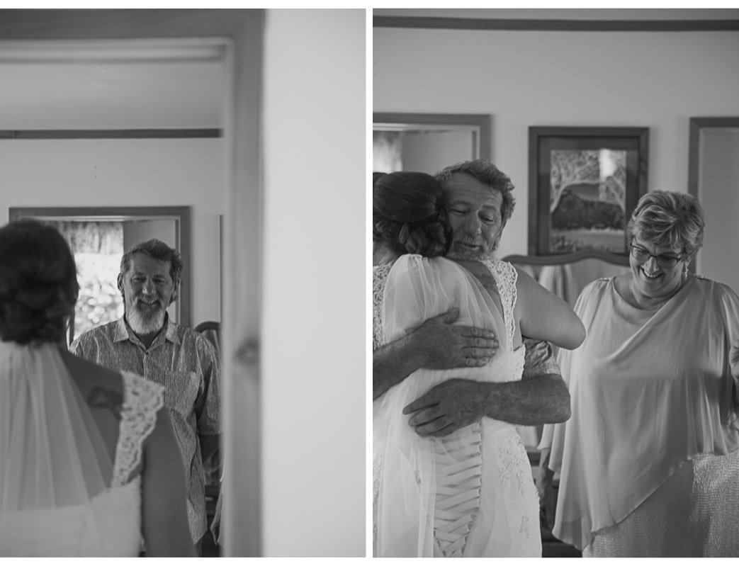 father of the bride seeing his daughter in her wedding dress for the first time