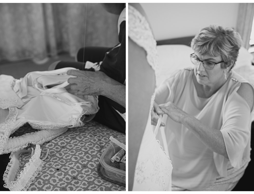 mother of the bride sewing up wedding dress