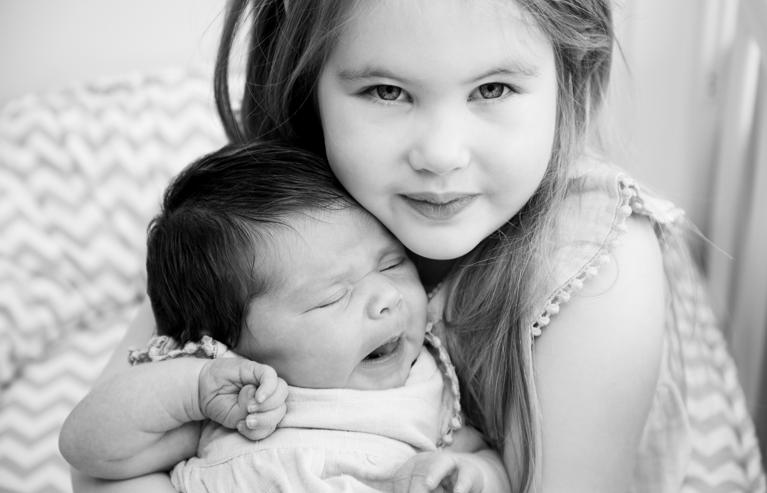 sisters cuddling together