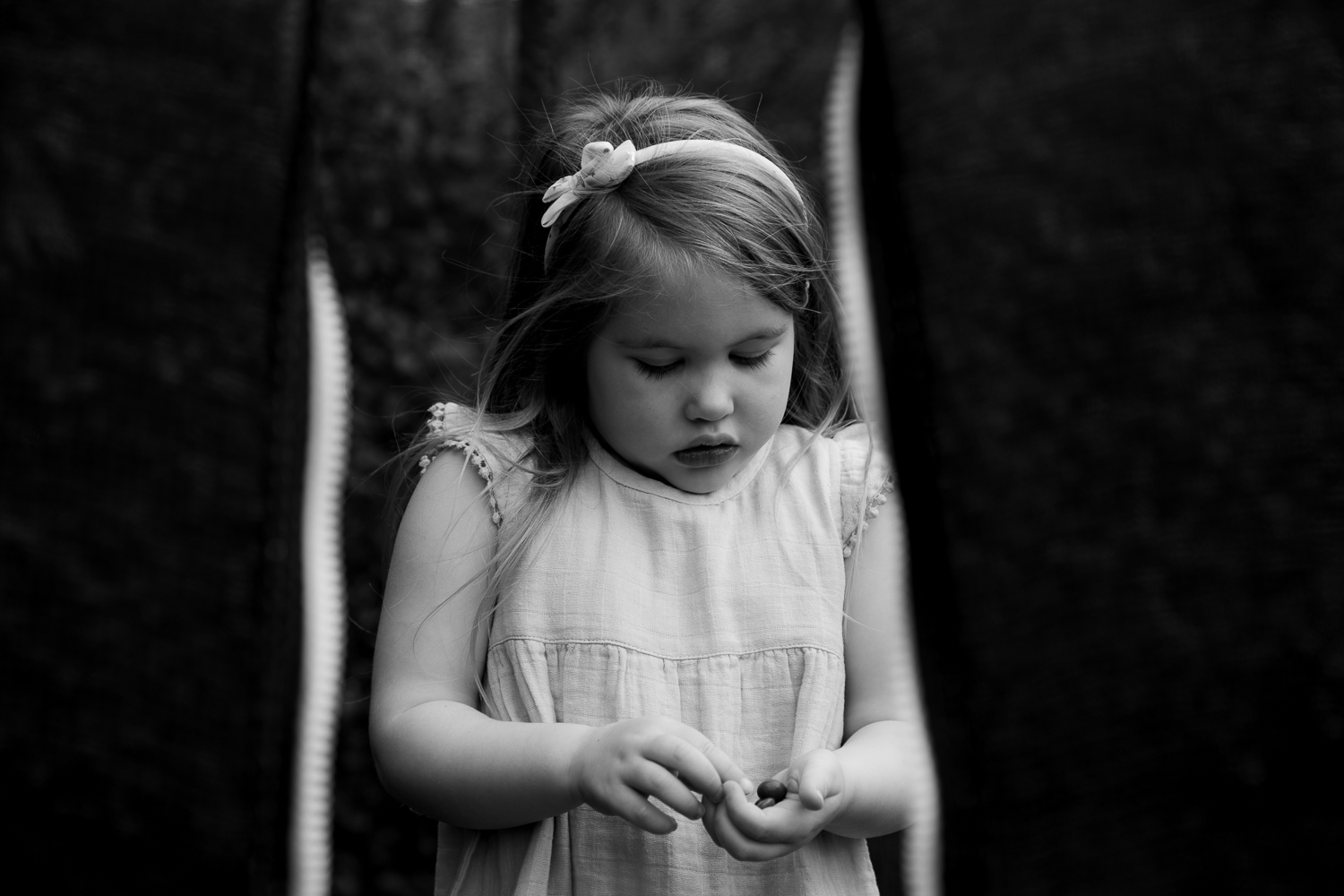 little girl playing on trampoline