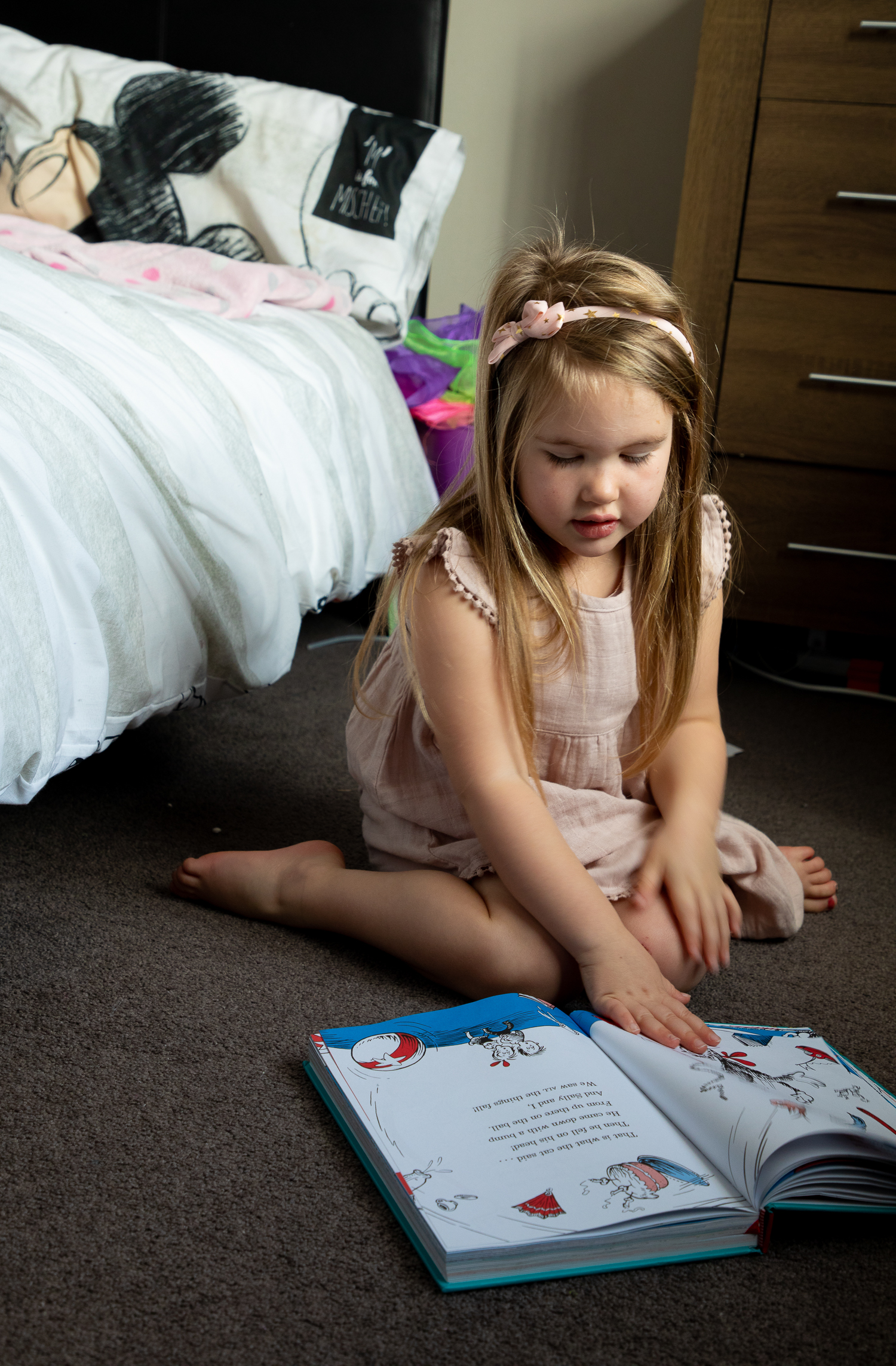 little girl reading a book