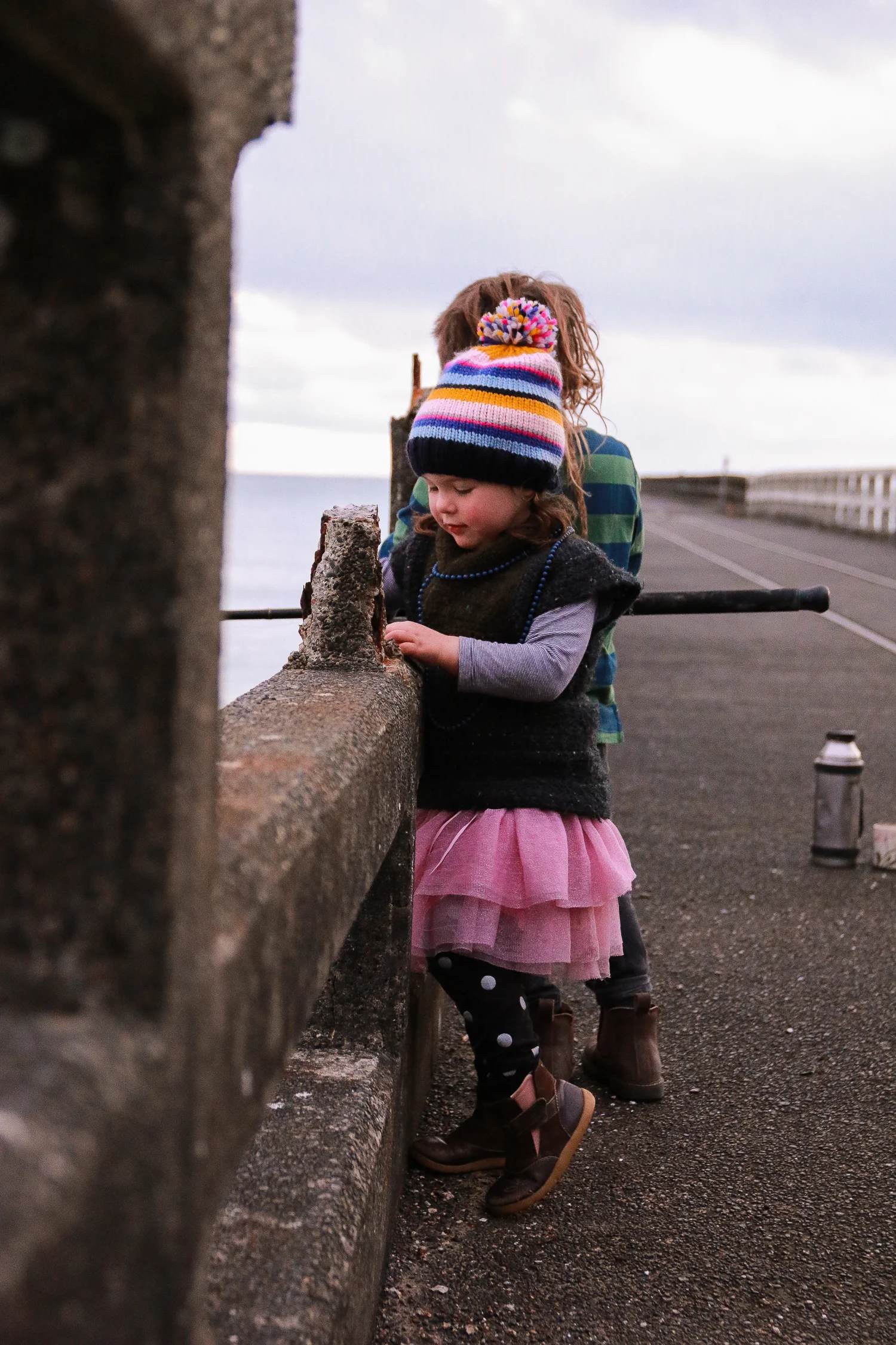 little-girl-fishing-off-the-tolaga-bay-wharf-at-sunrise.jpg