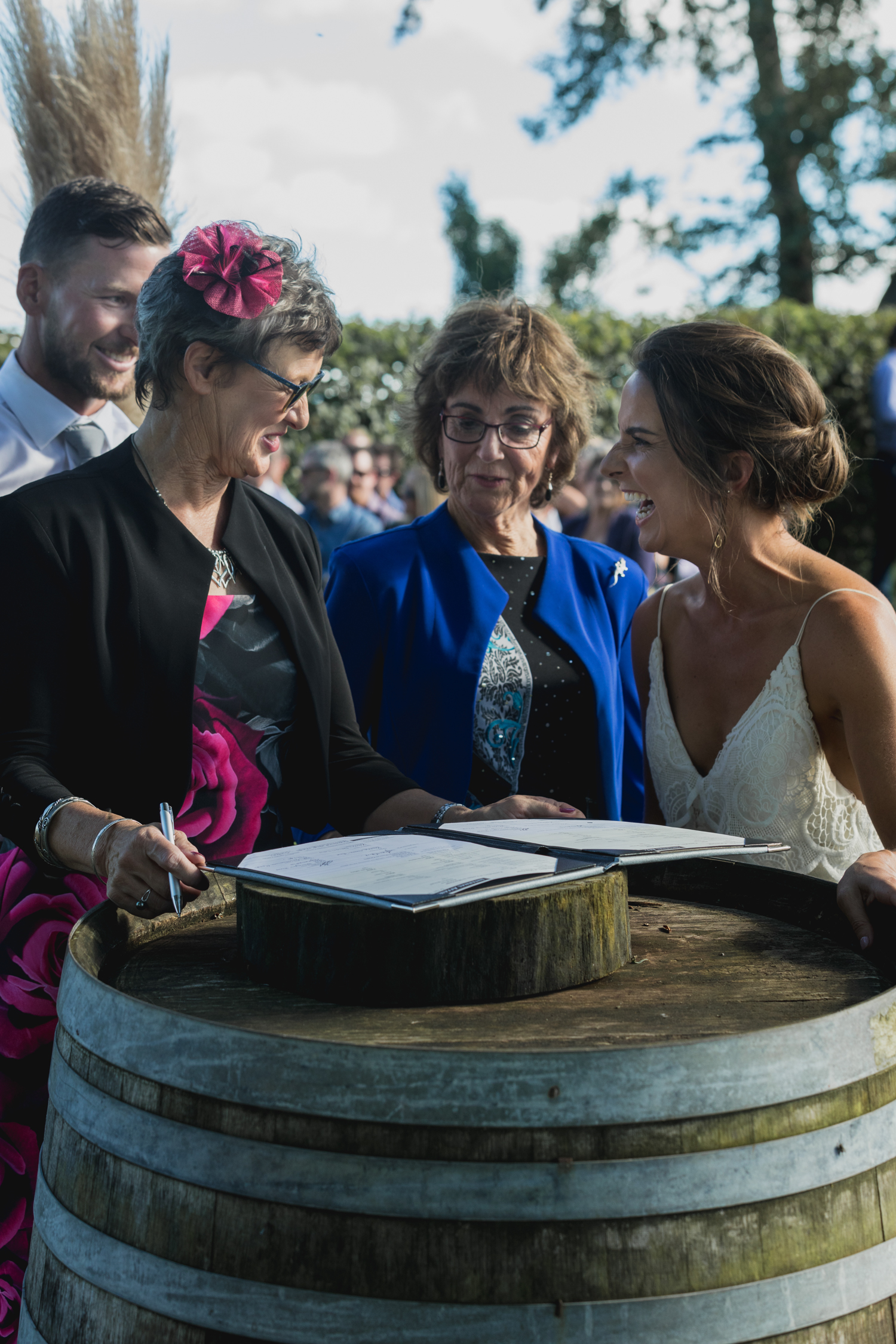 wedding-at-the-red-barn-new-zealand-wedding-photographer-mums-signing-register.jpg