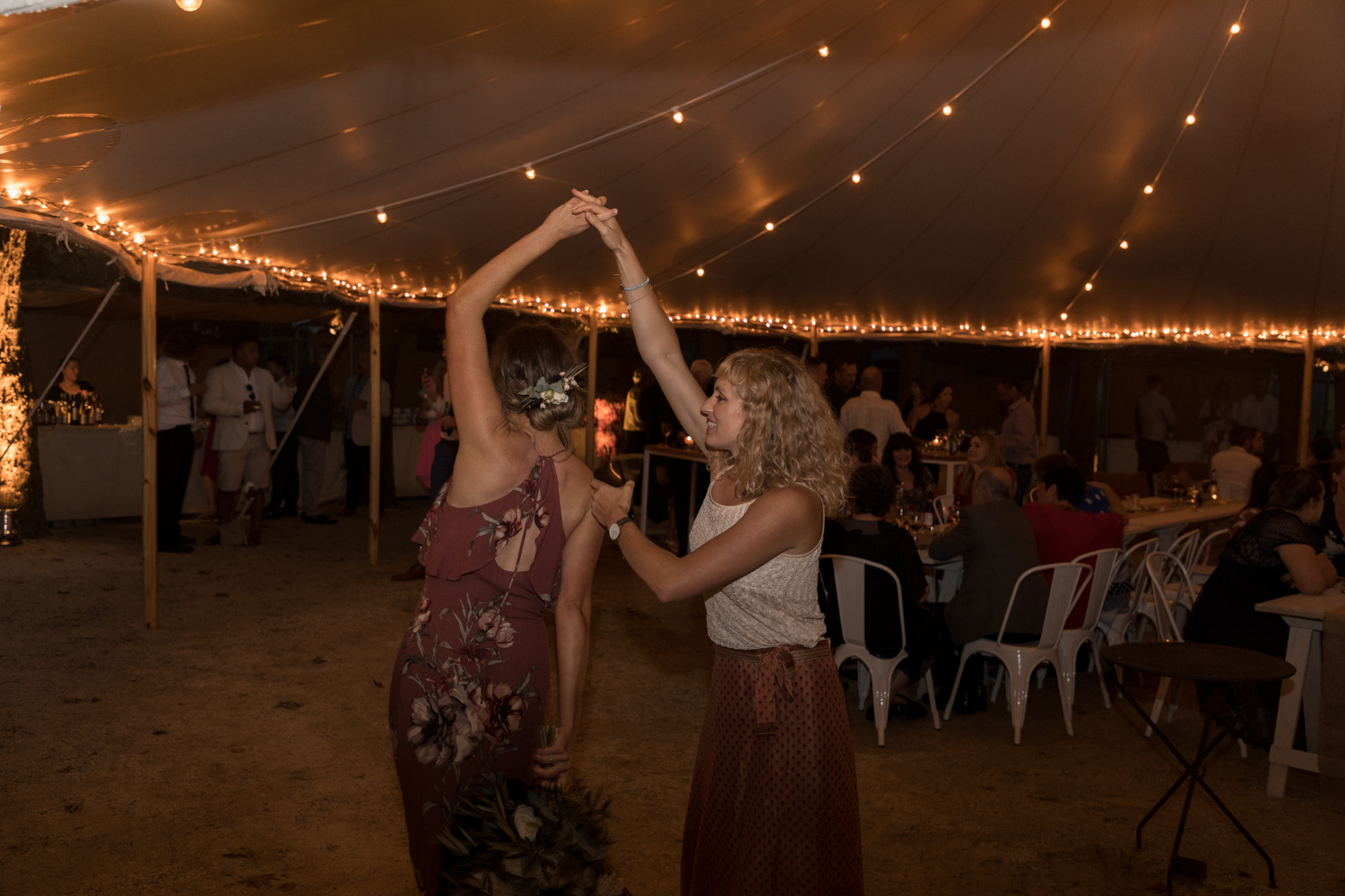 black-barn-winery-wedding-hawkes-bay-wedding-photographer-guestst-dancing-in-lights.jpg