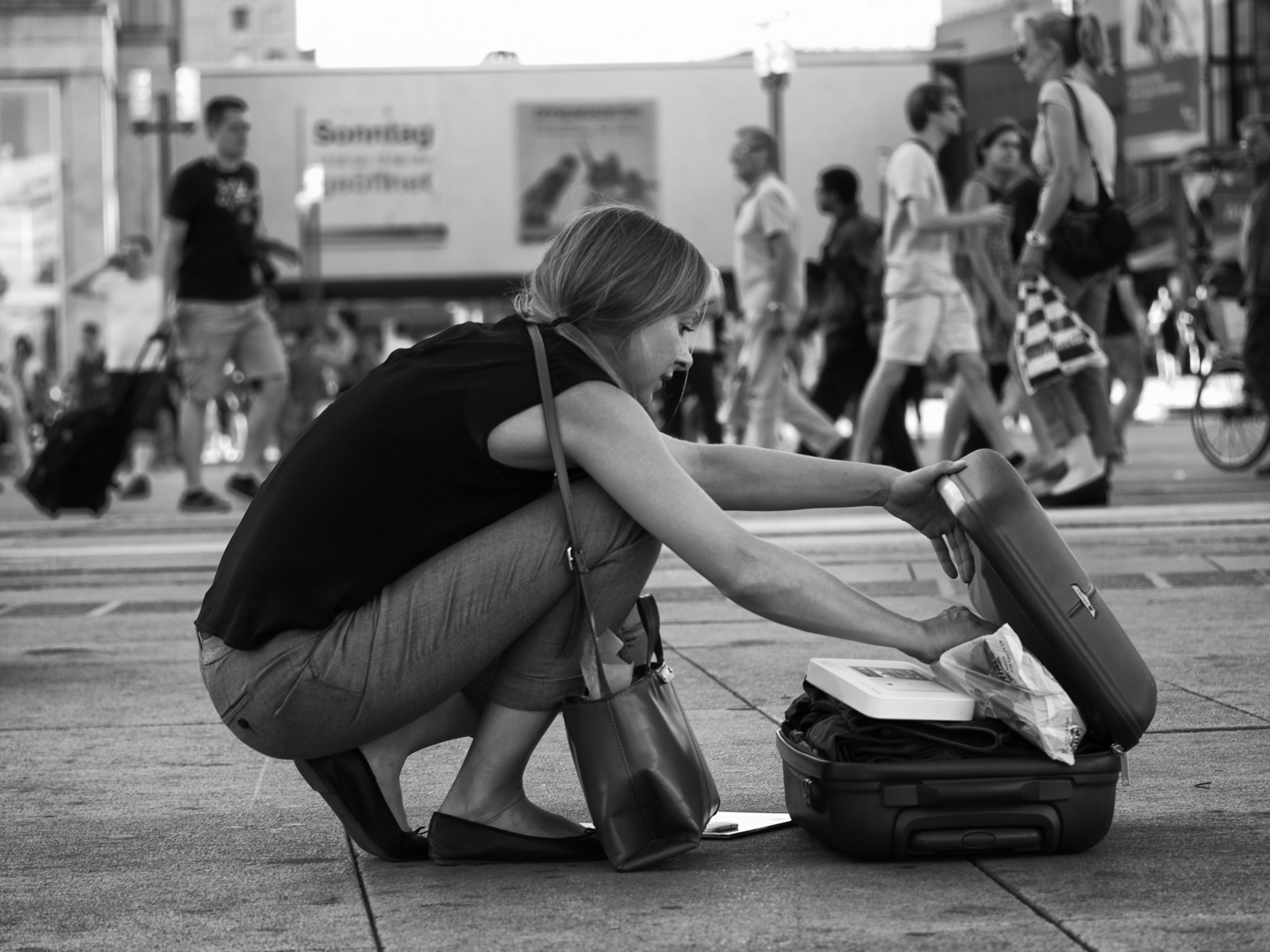 “ People on Alexanderplatz III ,” by Sascha Kollmann on Flickr . Licensed under CC BY-SA 2.0 .