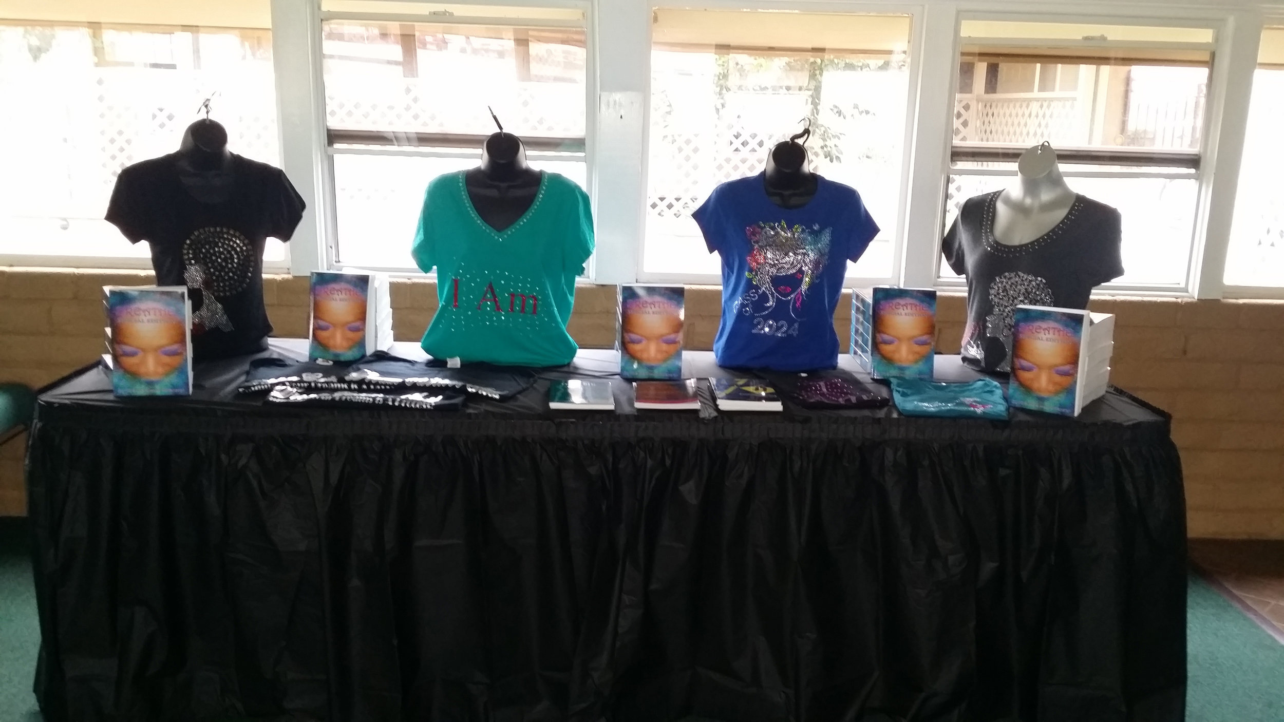 TableDisplaywithbooksandShirts.jpg