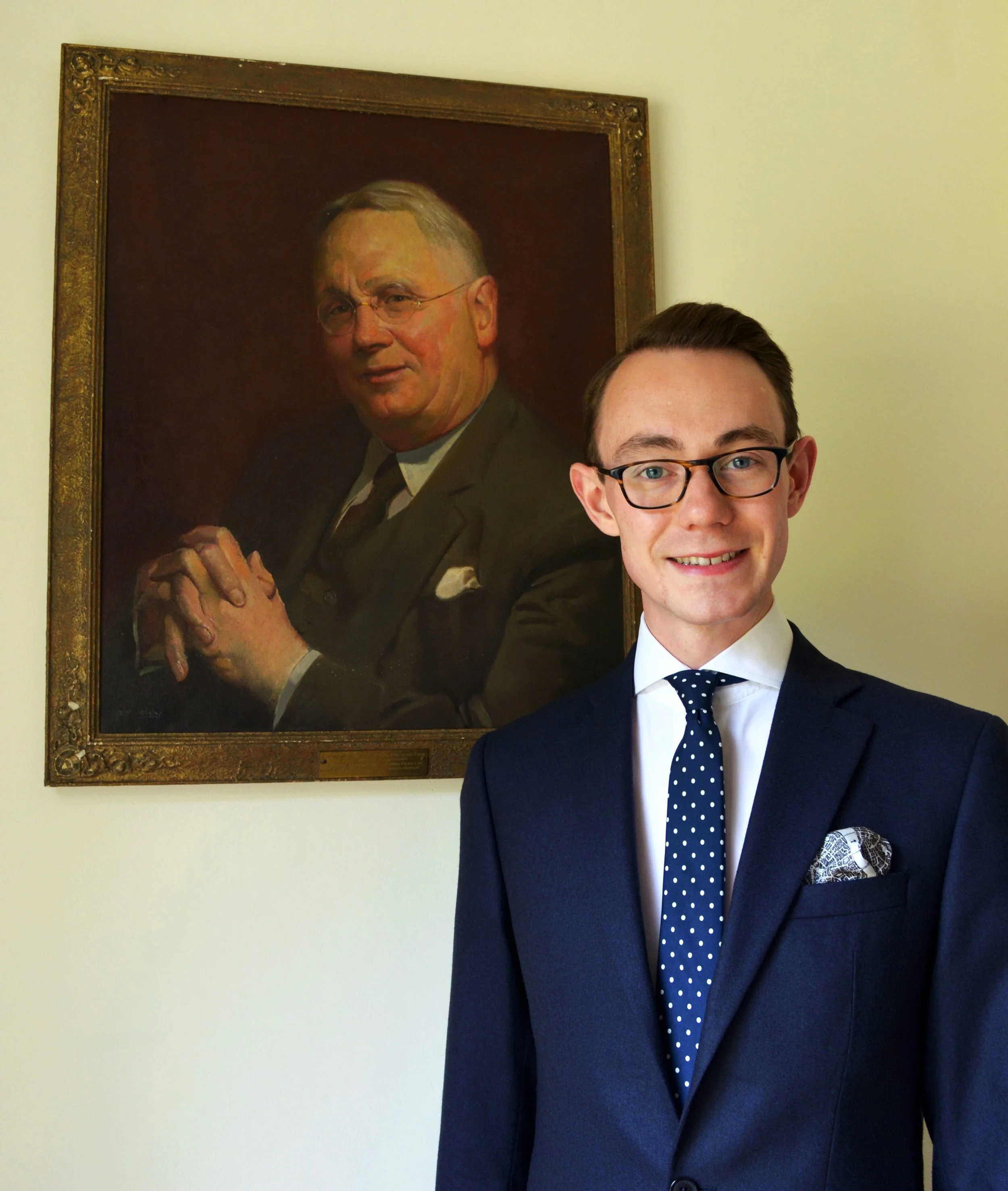 Nicholas Bowman-Scargill with painting of Great-Grandfather