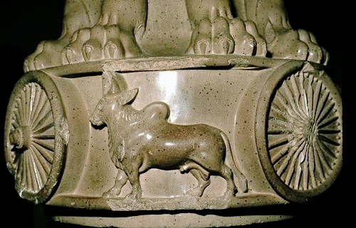 Lion motif on base