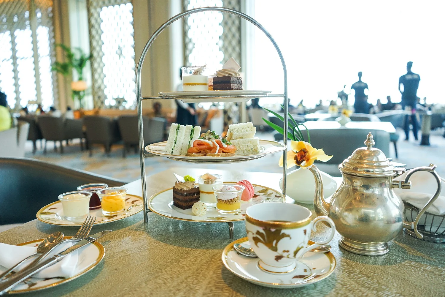 The "afternoon tea" platter at the Shangri-La. Savoury items included vol-au-vents with creamy chicken filling, smoked salmon on mini toasts, creamy egg sandwich triangles and cucumber and cheese sandwich triangles. Sweet items included scones with cream, strawberry jam and passion fruit curd, strawberry macroon, white chocolate truffle, chocolate and hazelnut layer cake and white chocolate panna cotta with mango and white chocolate jelly.