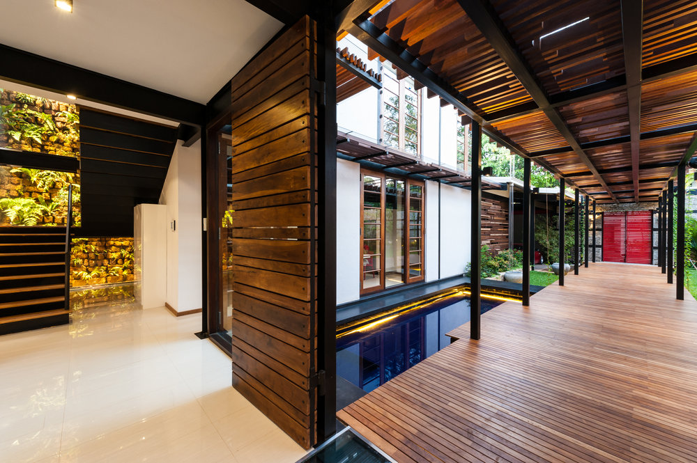 House No. 8 - raised timber walkway into building