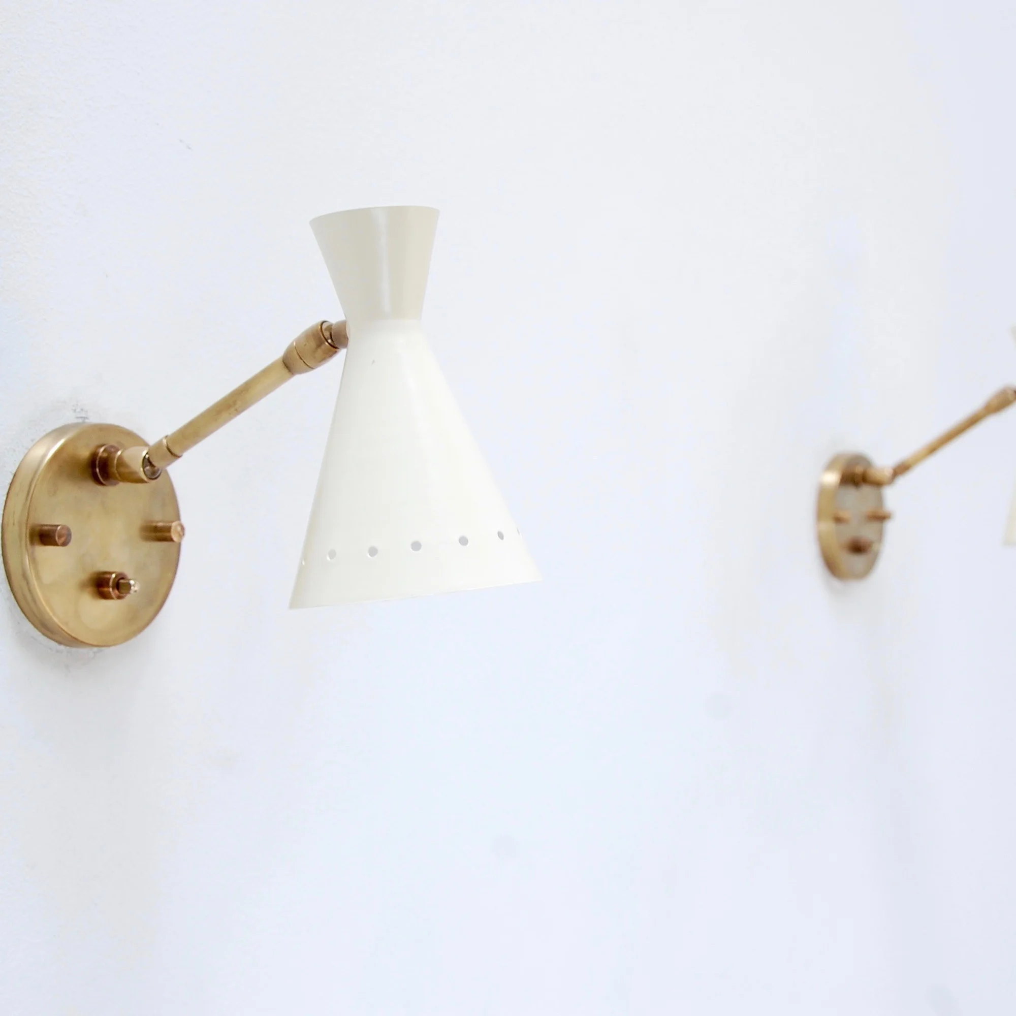 PerforatedArticulatedSconces7.jpg