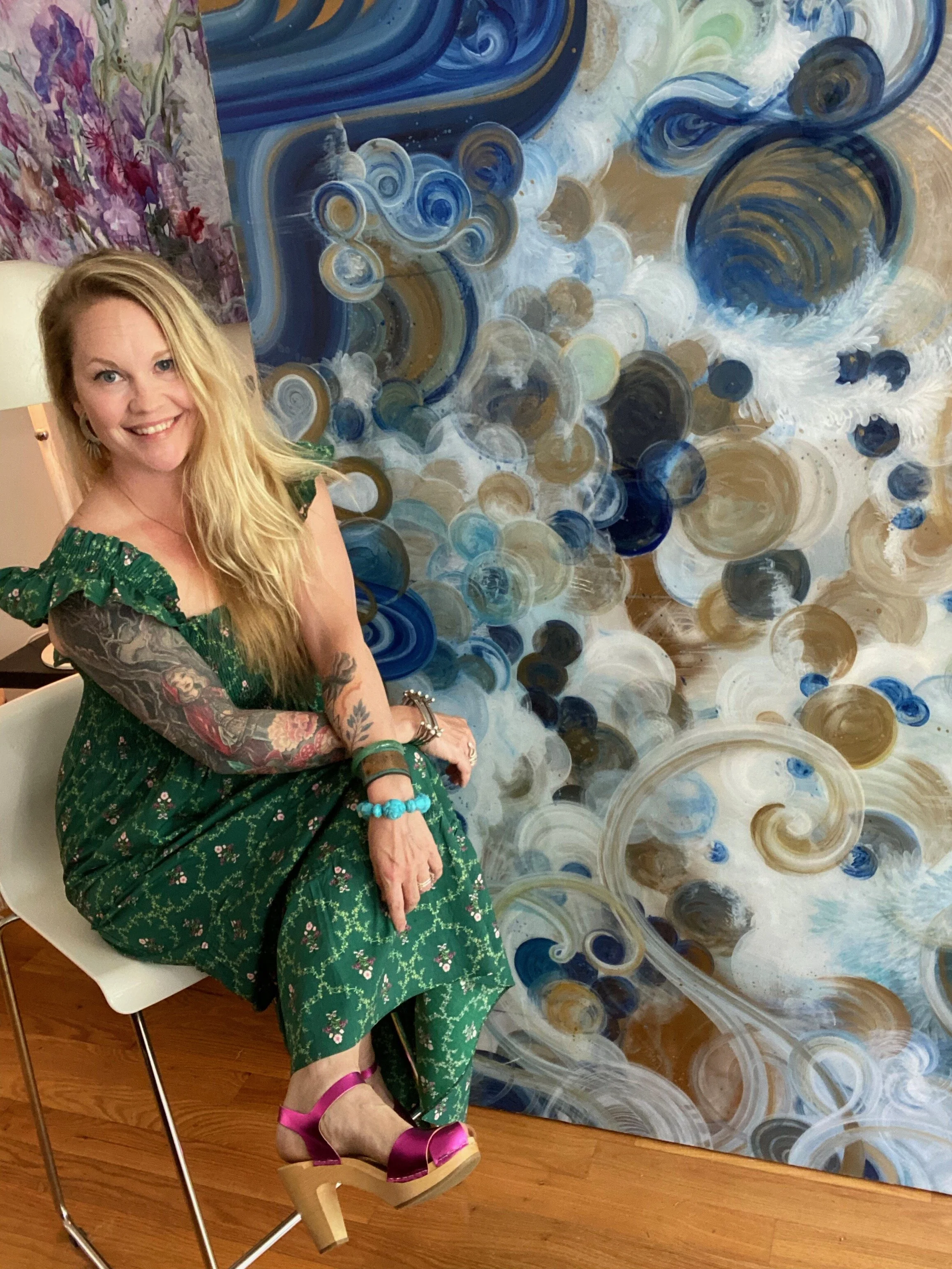 artist amanda moody in studio with passing through mixed media resin on aluminum large scale art