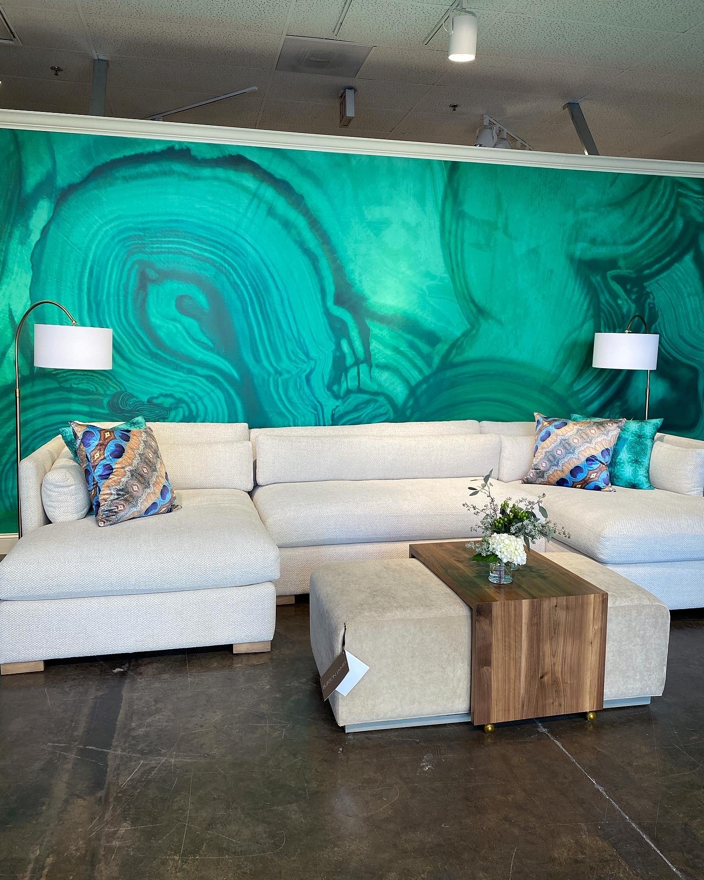 installation of Malachite wallpaper mural at High Point Market by artist Amanda Moody