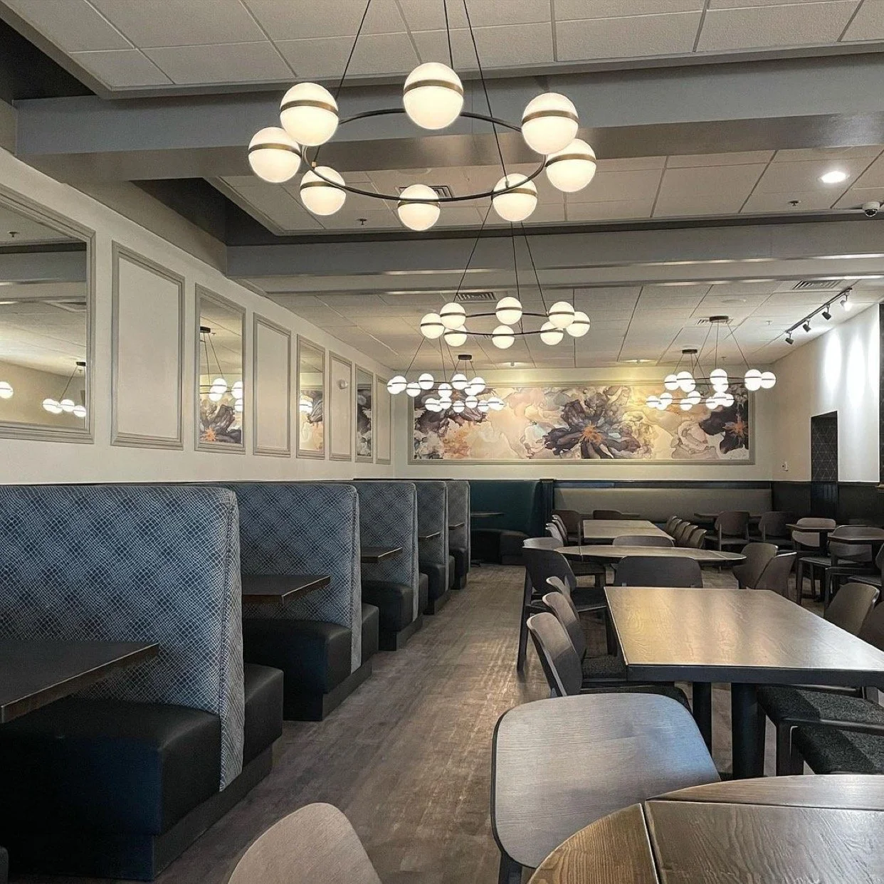 installation of Smoke and Mirrors wallpaper mural by Amanda Moody for Bombshelves at Harry's Grille Charlotte NC restaurant design