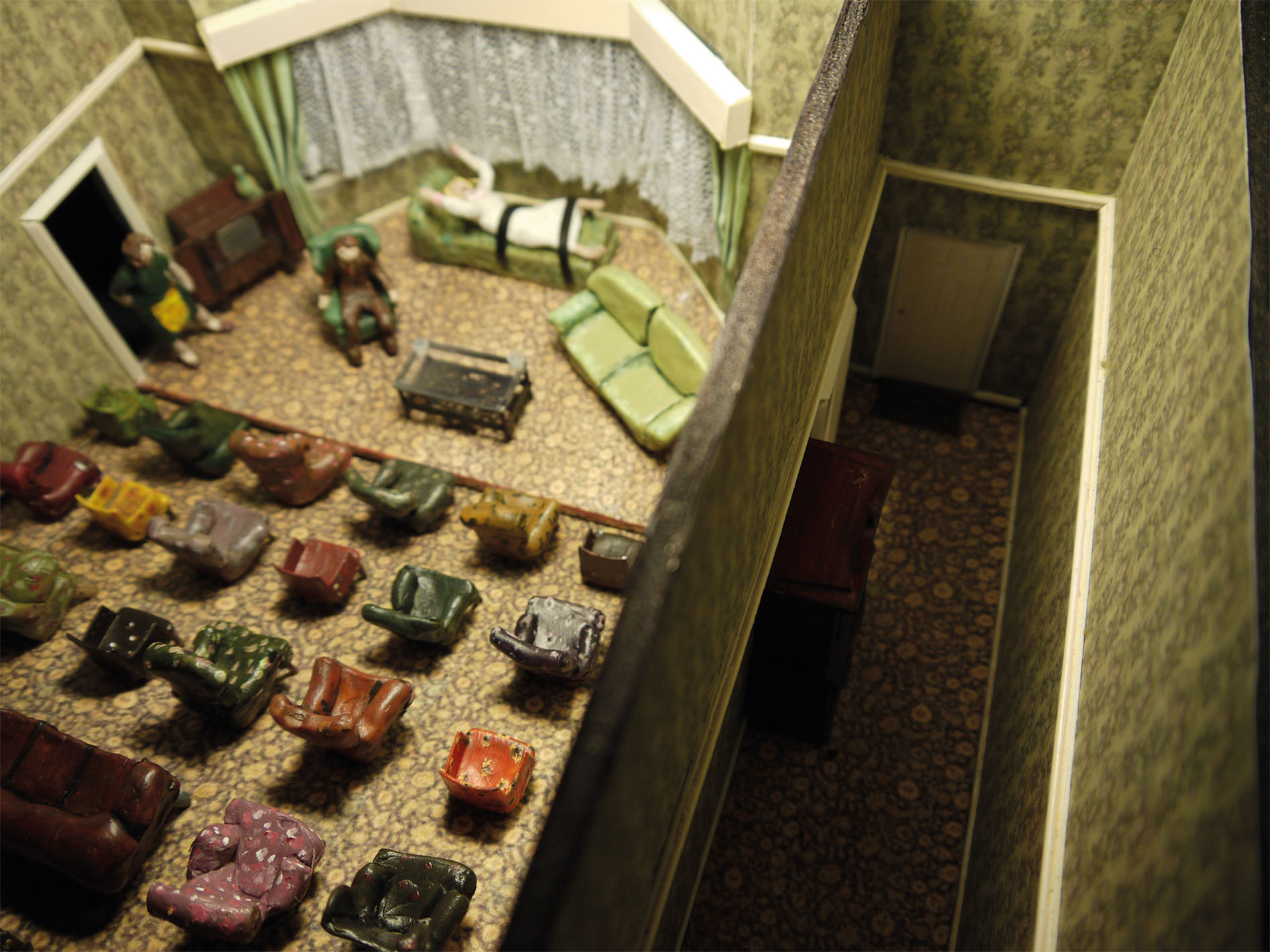 This set was designed to make the audience feel as uncomfortable as possible; attempting to break the theatrical conventions of the boundary between audience and performer, and its role in complicity. The text is intimate and highly disturbing, the well-meaning Bates family unwittingly inviting pure evil into their modest living room. How would the audience feel if they too were simply guests invited into the house? They are forced into conventional silence by the awareness that they are watching a play, but the intimate circumstances causes them to feel more like an immoral voyeur- their silence complicit of Martin's evil acts.