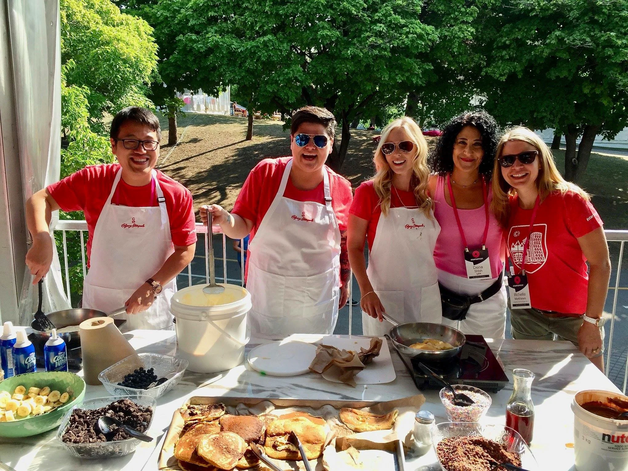 Members of the Calgary crew flipping and serving pancakes sponsored by Calgary Stampede. L to R: Jonathan Chan (ShareSmart), Bobbie Racette (Virtual Gurus), Jenn Delconte (Startup Calgary), Dena Shlah (IGBA), Richelle Martin (Calgary Technologies Inc.)