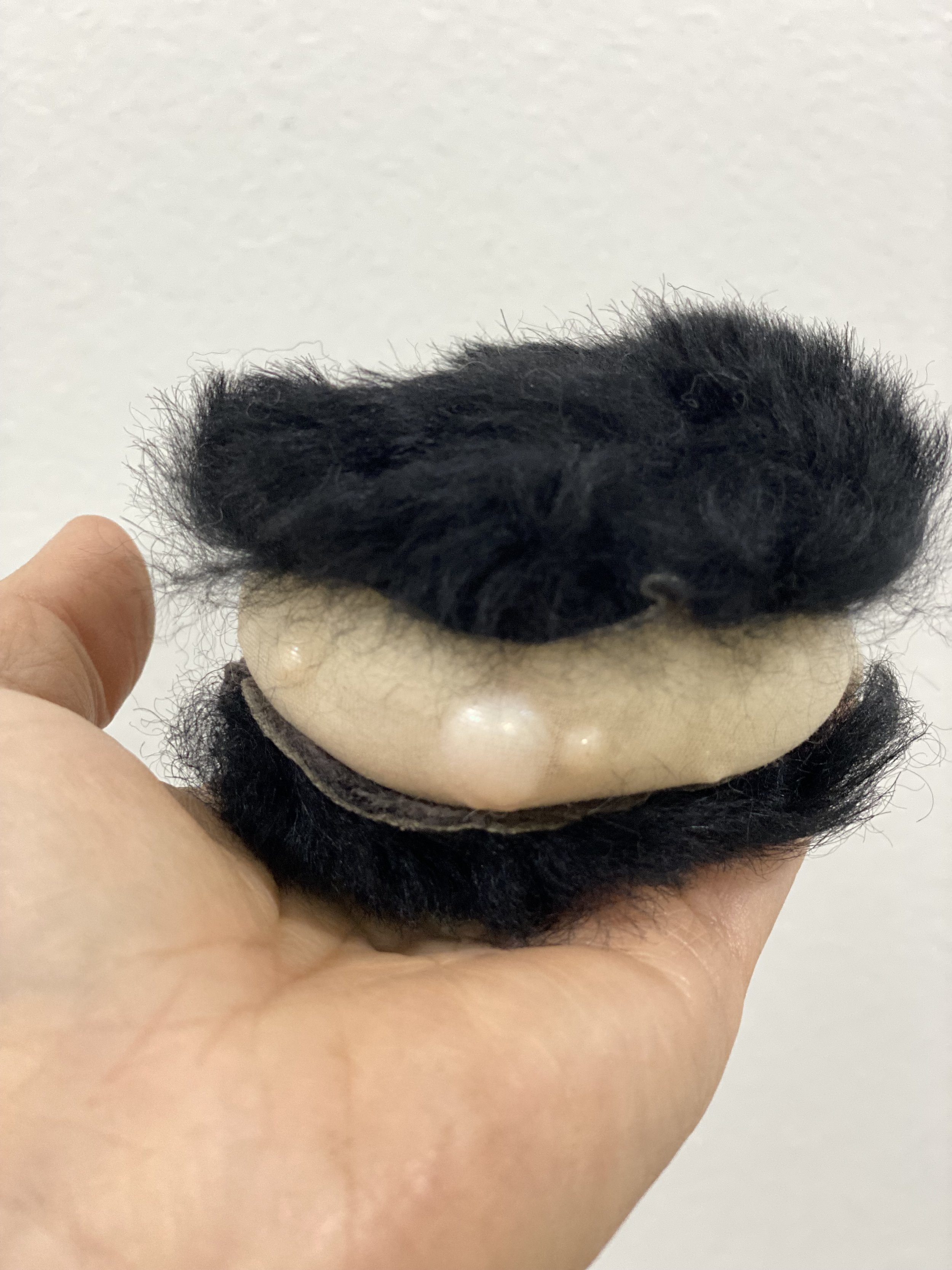 Wen-hao Tien, Oreo cookie sculpture in process, 2022, created with silk, wool, fur, leather, and pearls.
