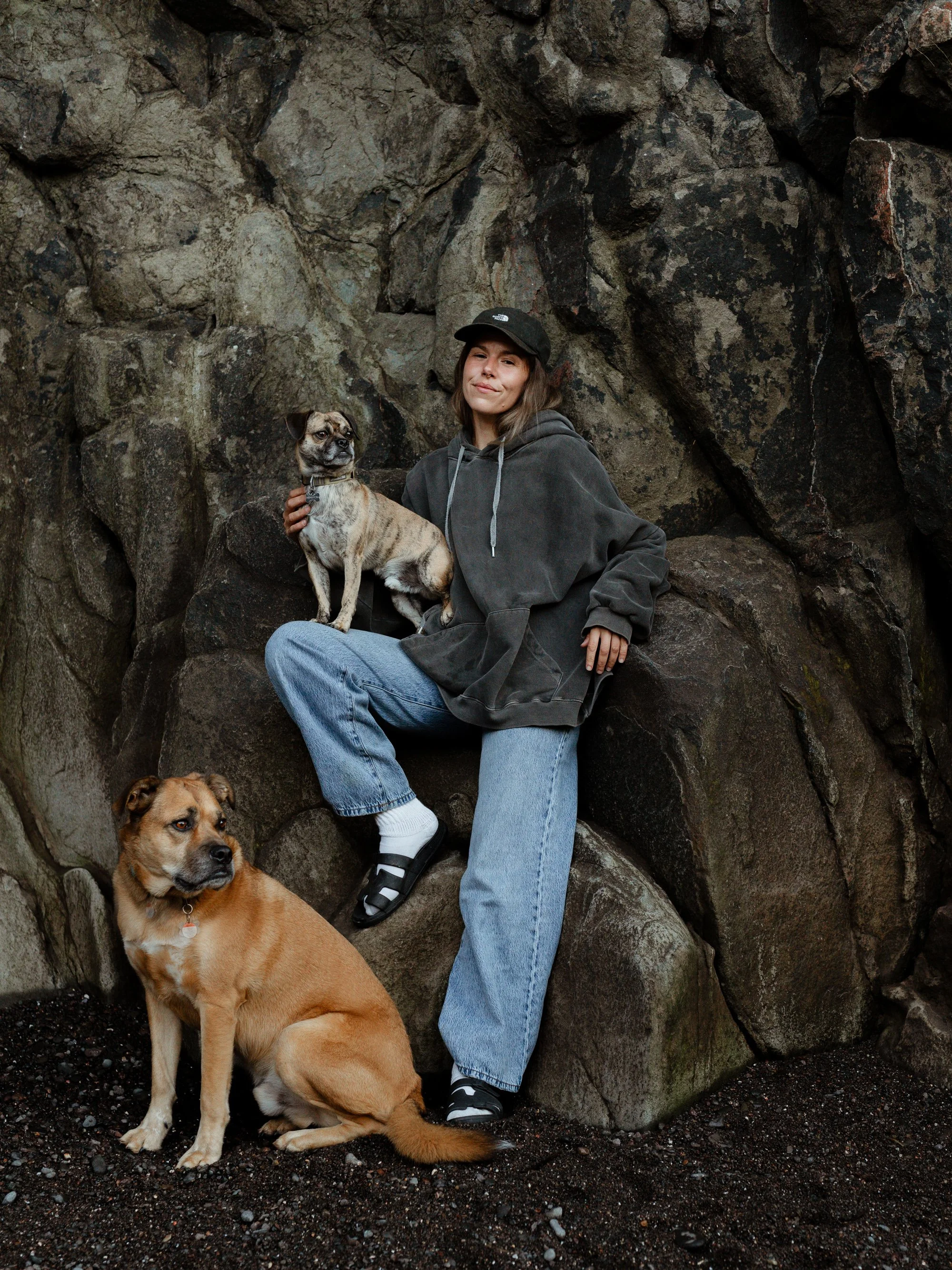 Halifax photographer Alexa Cude sitting at Baxter's Harbour with her two rescue dogs Kingsley and Winston