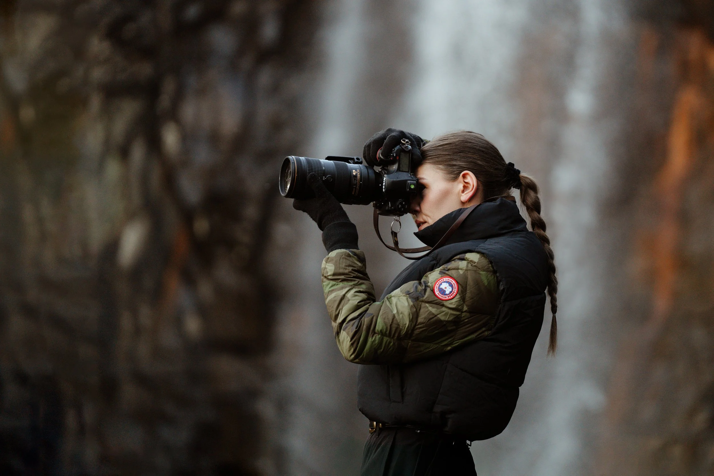 Halifax photographer Alexa Cude shooting on location in a Canada Goose jacket, portrait by Riaz Oozeer