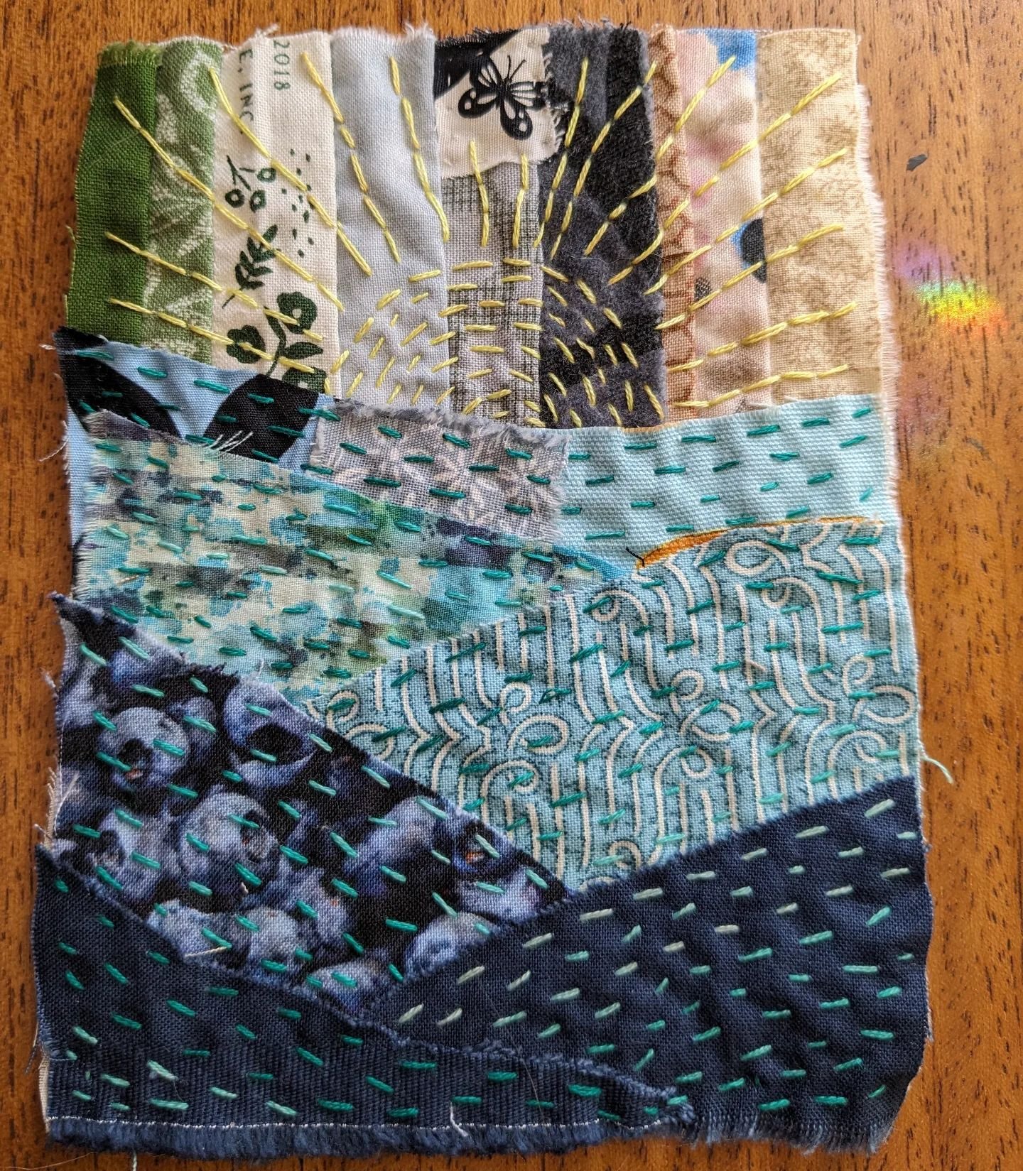 This week's #slowstichwithk3n prompt is to portray Earth; two-thirds water, one-third land. This one features a shard of rainbow from the memorial prism @thesusanito gave us.
.
.
.
#slowstitch #slowstitching #embroidery #fiberart #needlework