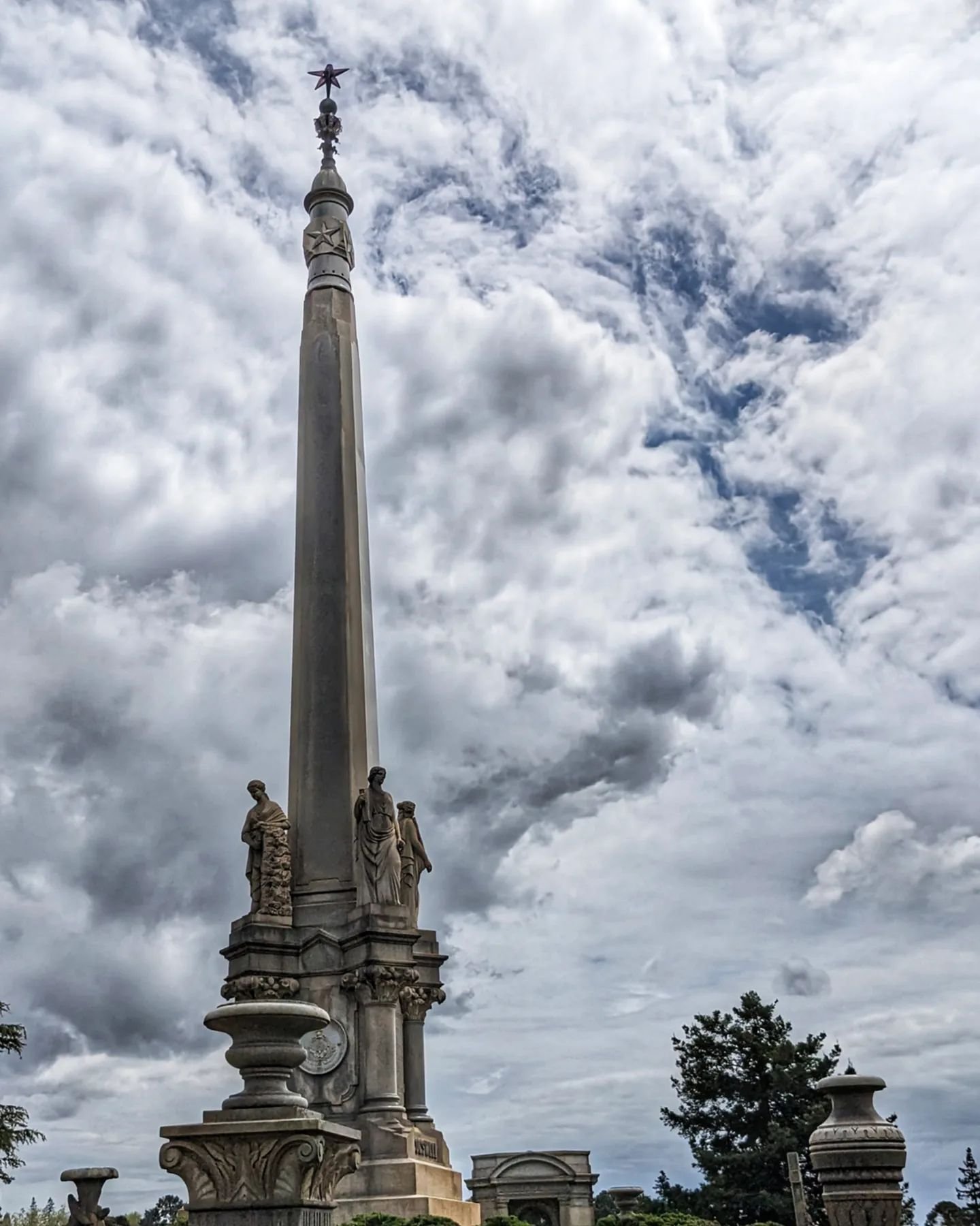 Cogswell monument on a cloudy day at the Mountain View Cemetery in Oakland. Henry Cogswell was a dentist to miners during the Gold Rush, and the four statues represent Faith, Hope, Charity and Temperance. He and his wife founded Cogswell College, whi