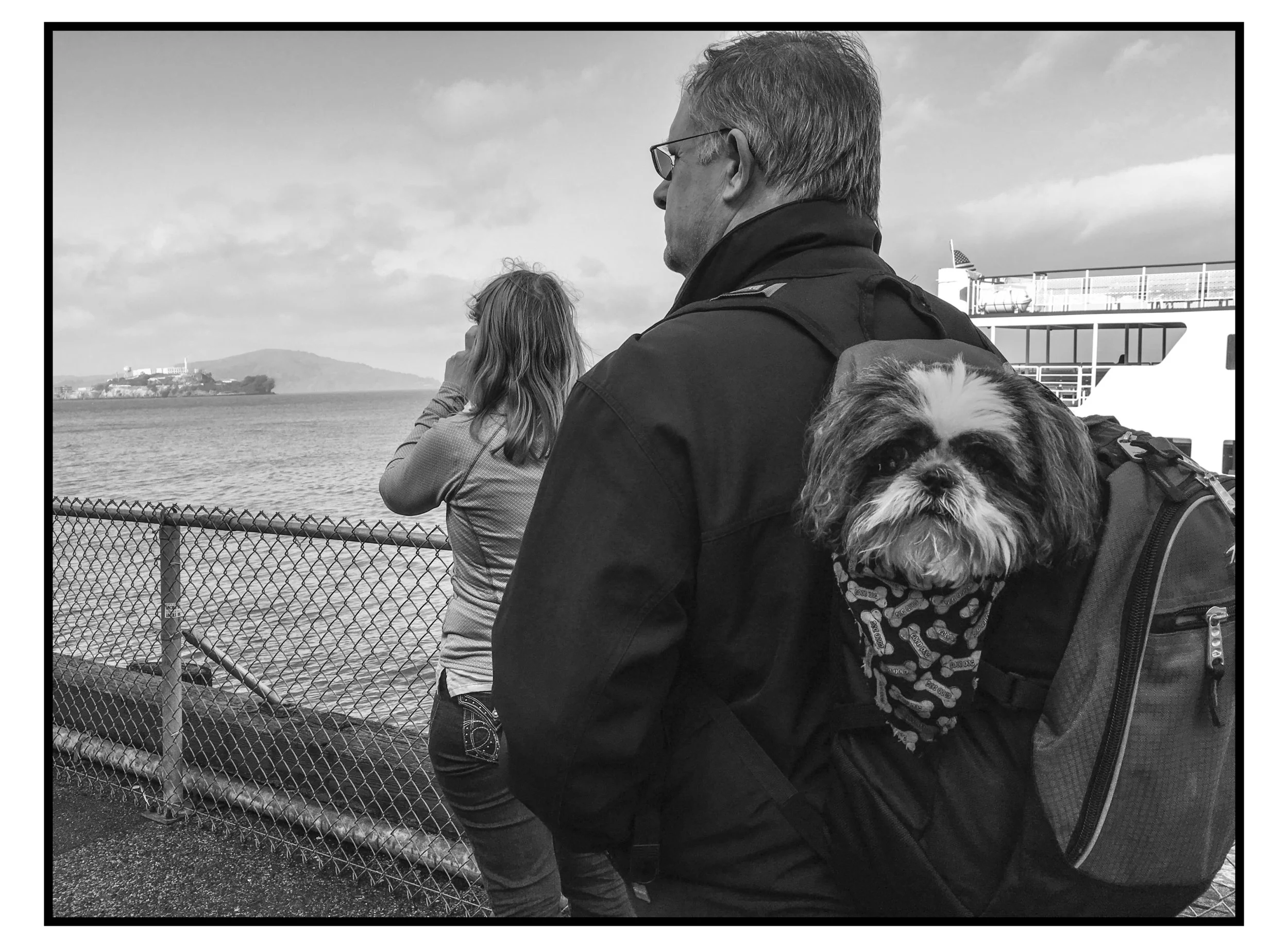  My parents and the family dog, Maggie, touring San Francisco, CA wth Alcatraz in the distance. 