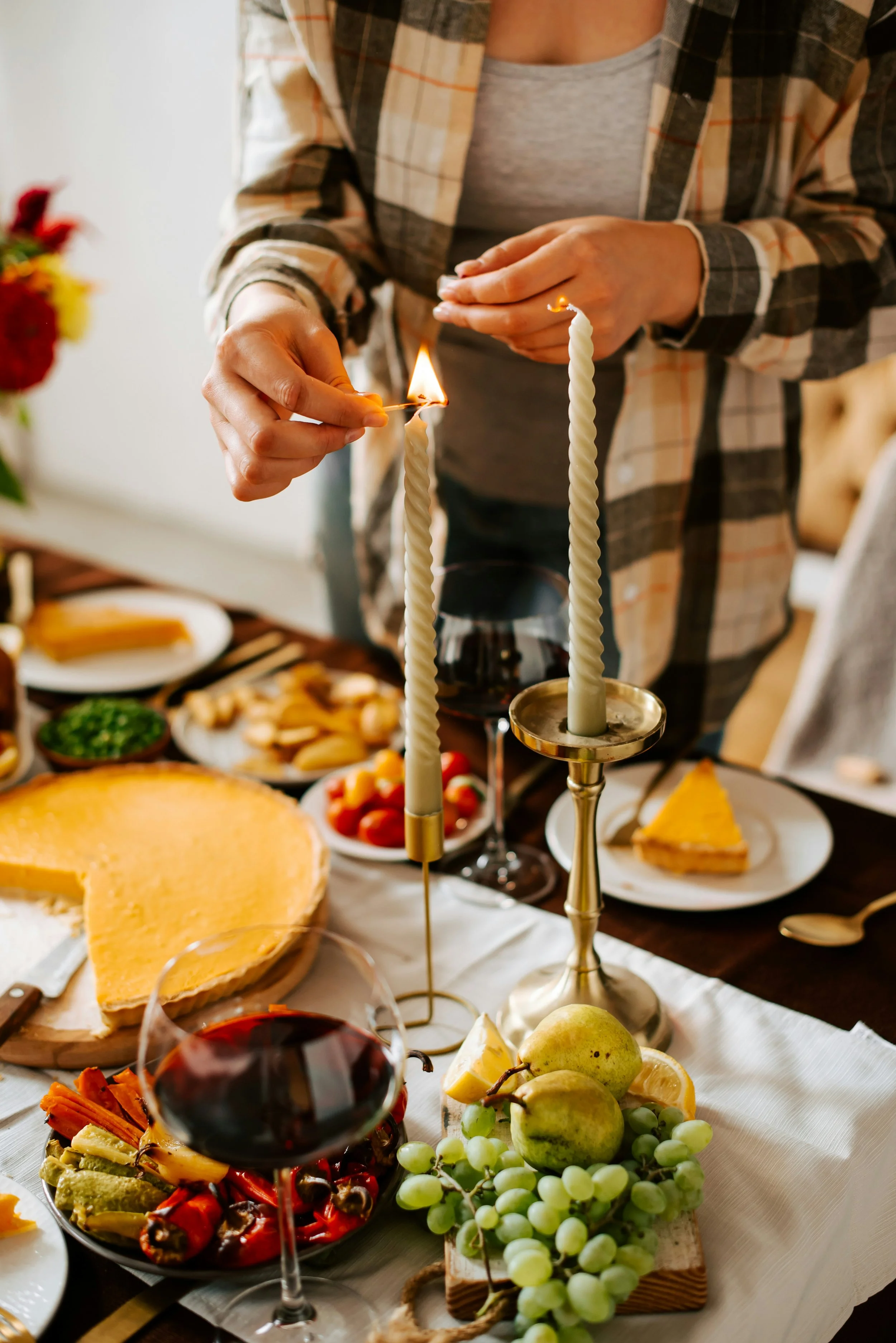 Lighting a candle for Thanksgiving Dinner | Thanksgiving Family Dynamics: How to not take the Bait