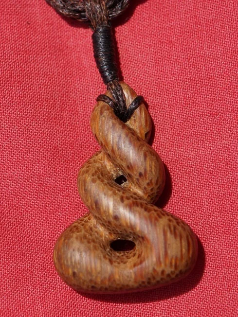 Eternal Coconut - 5 cm x 3.5 cm Coconut Wood pendant on a hand braided cord.  SOLD