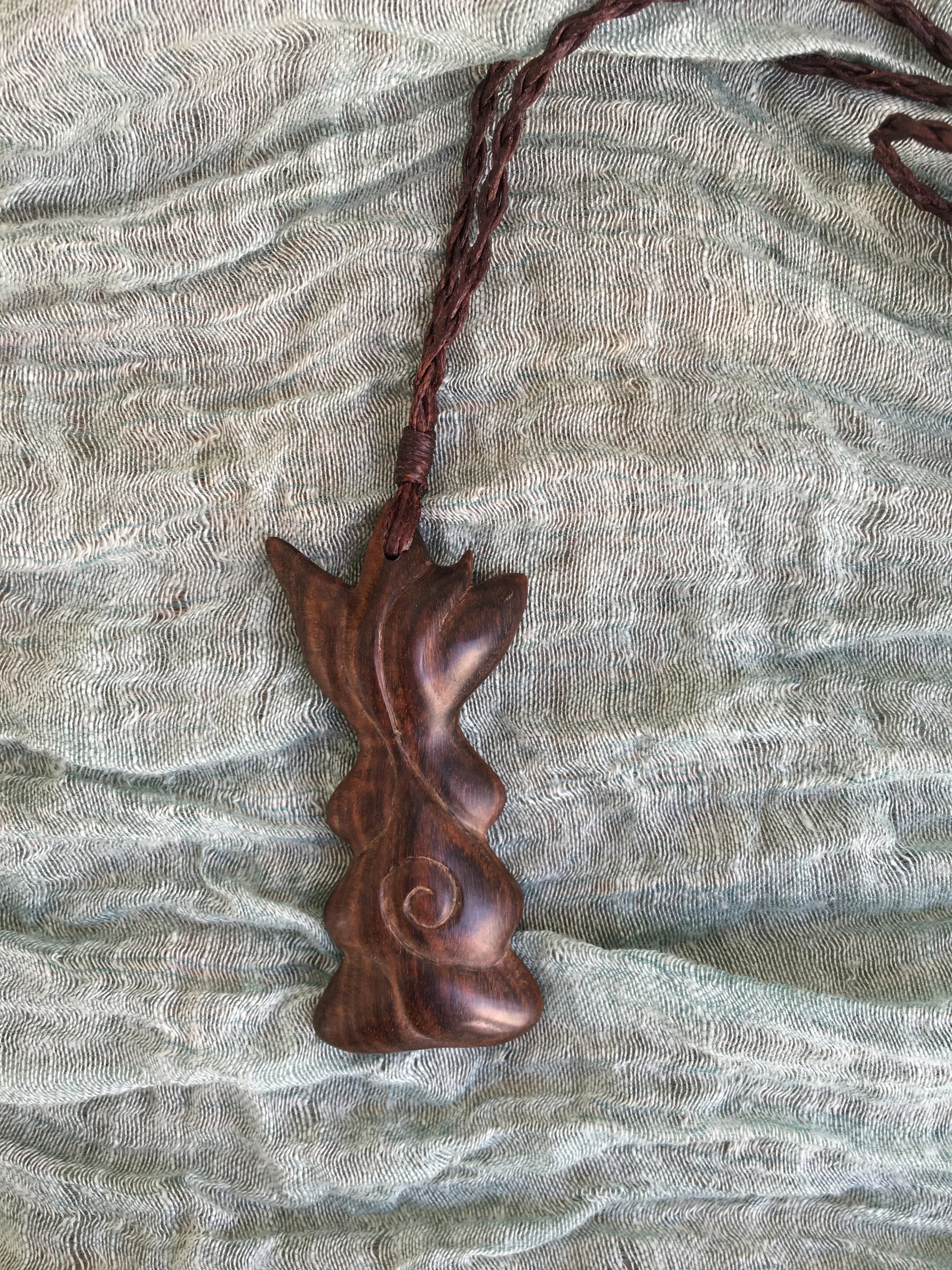 Mirror - Chatham Island Akeake wood and bronze on wax cord, 2018 (Available at Mahara Gallery)