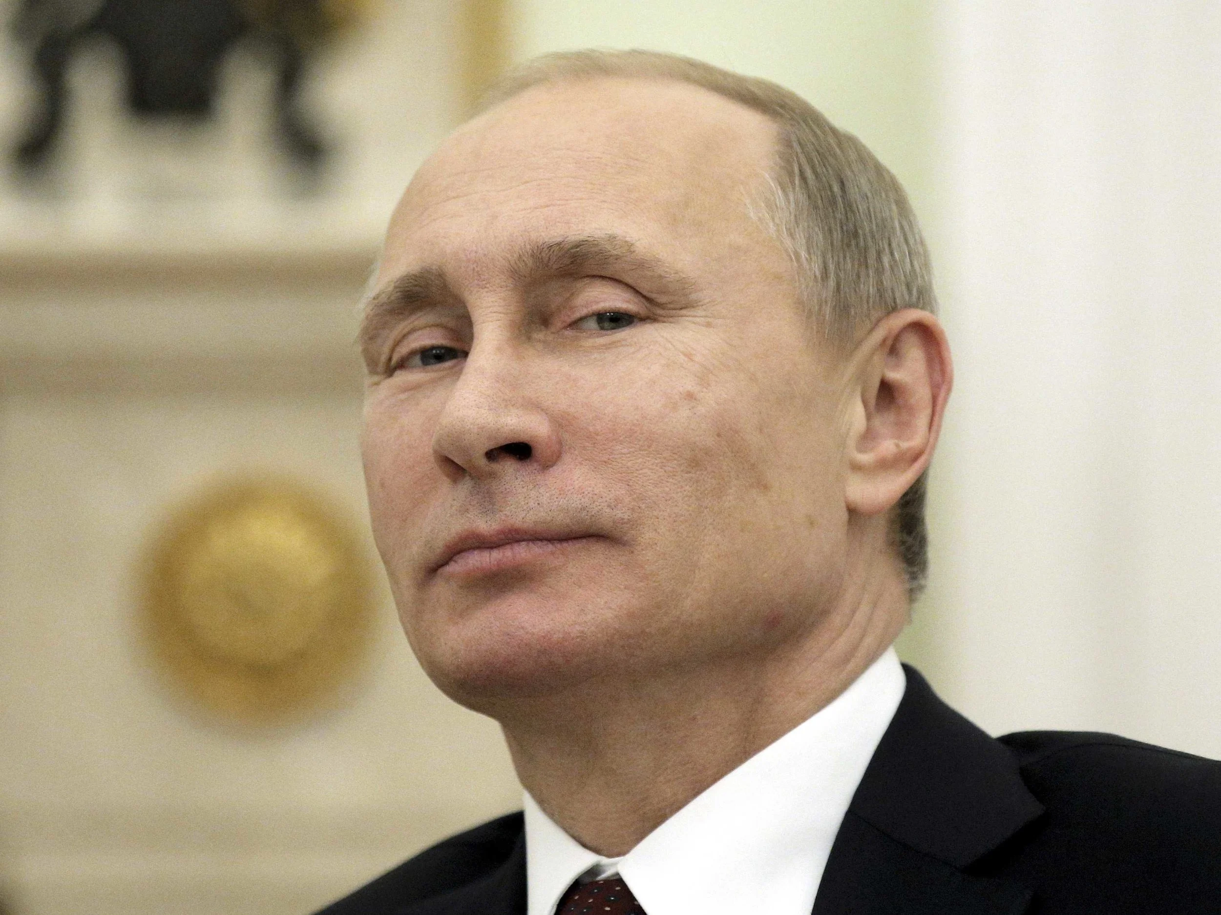 Putin criminal smile.jpg