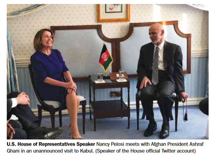 Pelosi in Afghan photo smiling.png