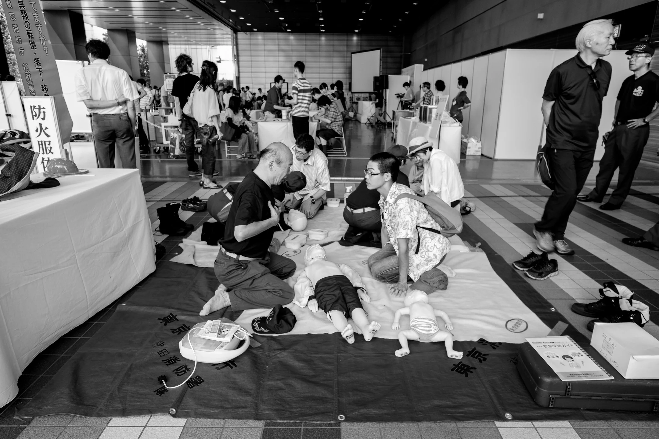 Fujifilm X-Pro1 - 14mm f/2.8 - 1/60 - f/5.6 - iso400 Lots of people trying to push dolls into the pavement or something.