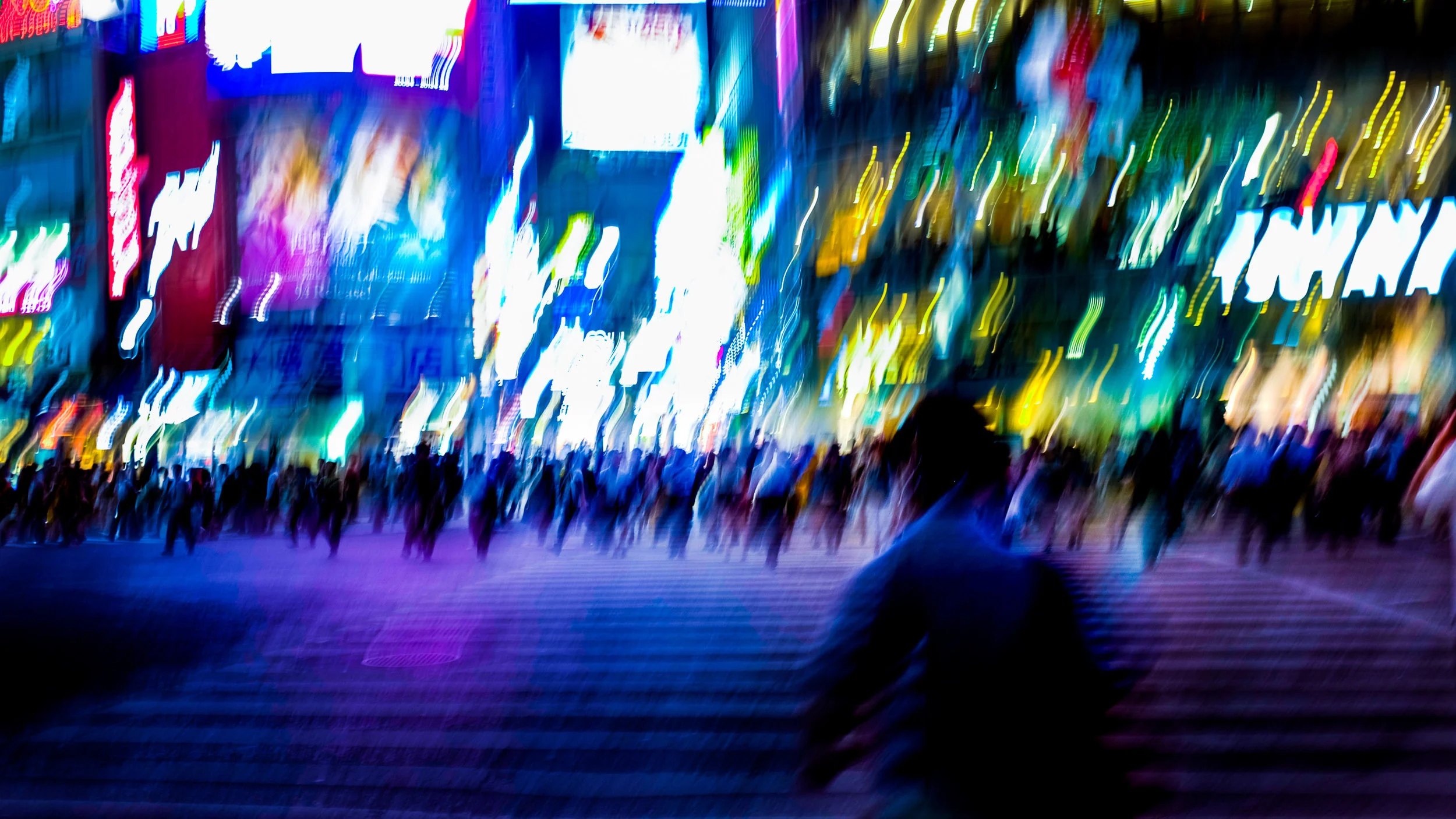 Fujifilm X-100S - 1/8 - f/2.8 - iso200 To capture that intimidating wave of people coming towards me, I choose a slow shutter speed, waited until the light turned green, stepped towards the people on the other side and clicked the button. It took me a couple of tries but I'm still happy with this picture. I even sold it a couple of times as a fine art print. 