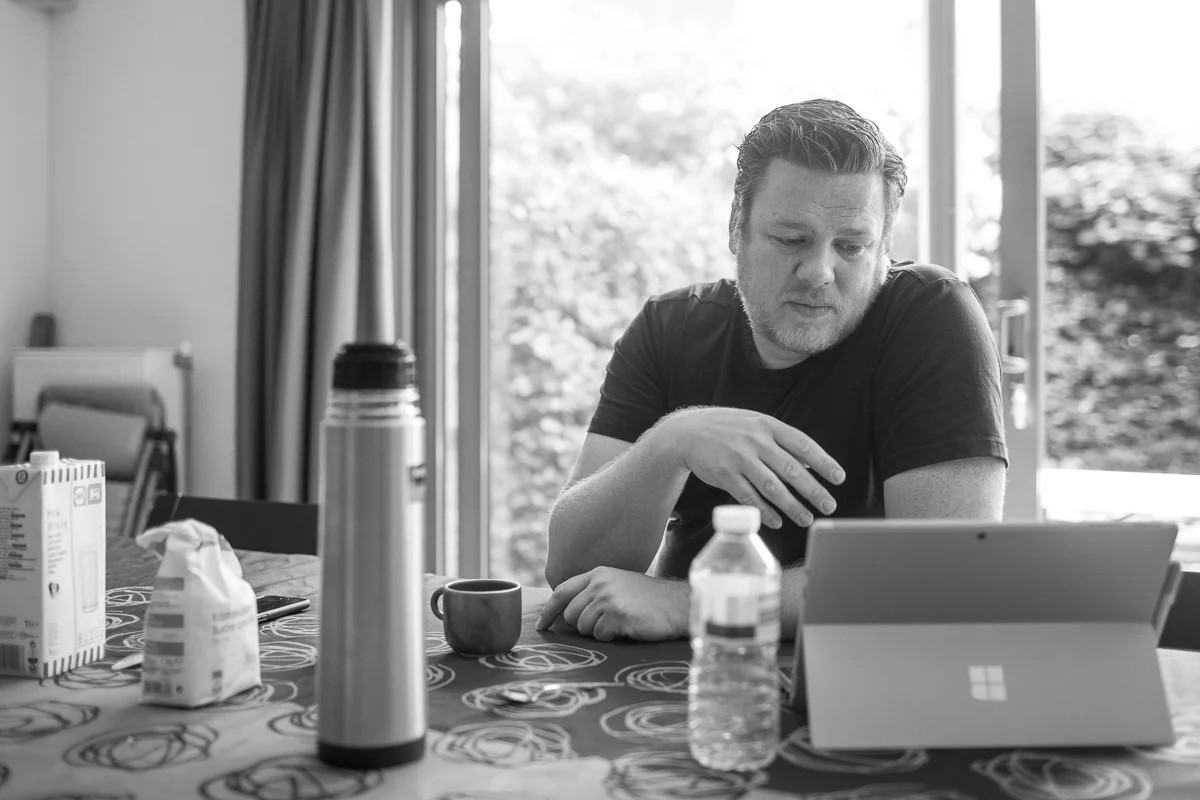 During a pre-workshop morning meeting at my living room table. The computer part is in the screen housing so there's less chance that I will kill another computer by spilling coffee on the keyboard (don't ask).