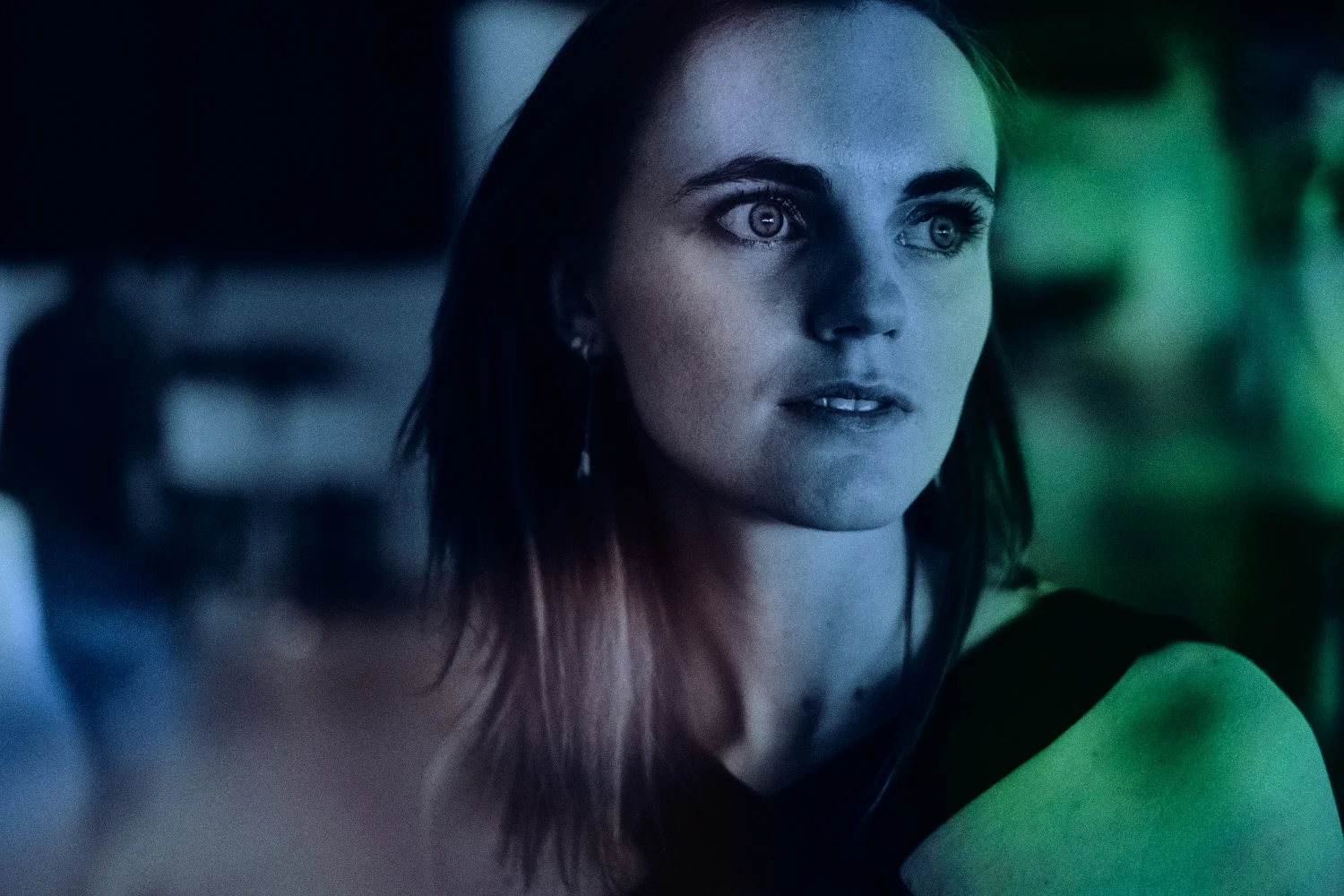 The picture above is an in-camera double exposure. I first took a black and white picture of the model. For the second picture I switched the camera to color and manual focus to overlay an out of focus frame of an area with different colors.