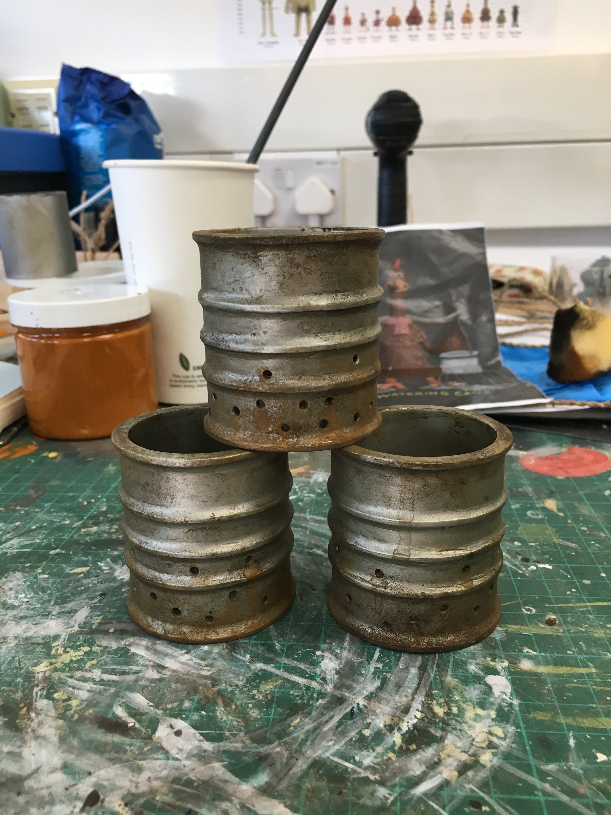 Watering tin cans (Copy) (Copy)