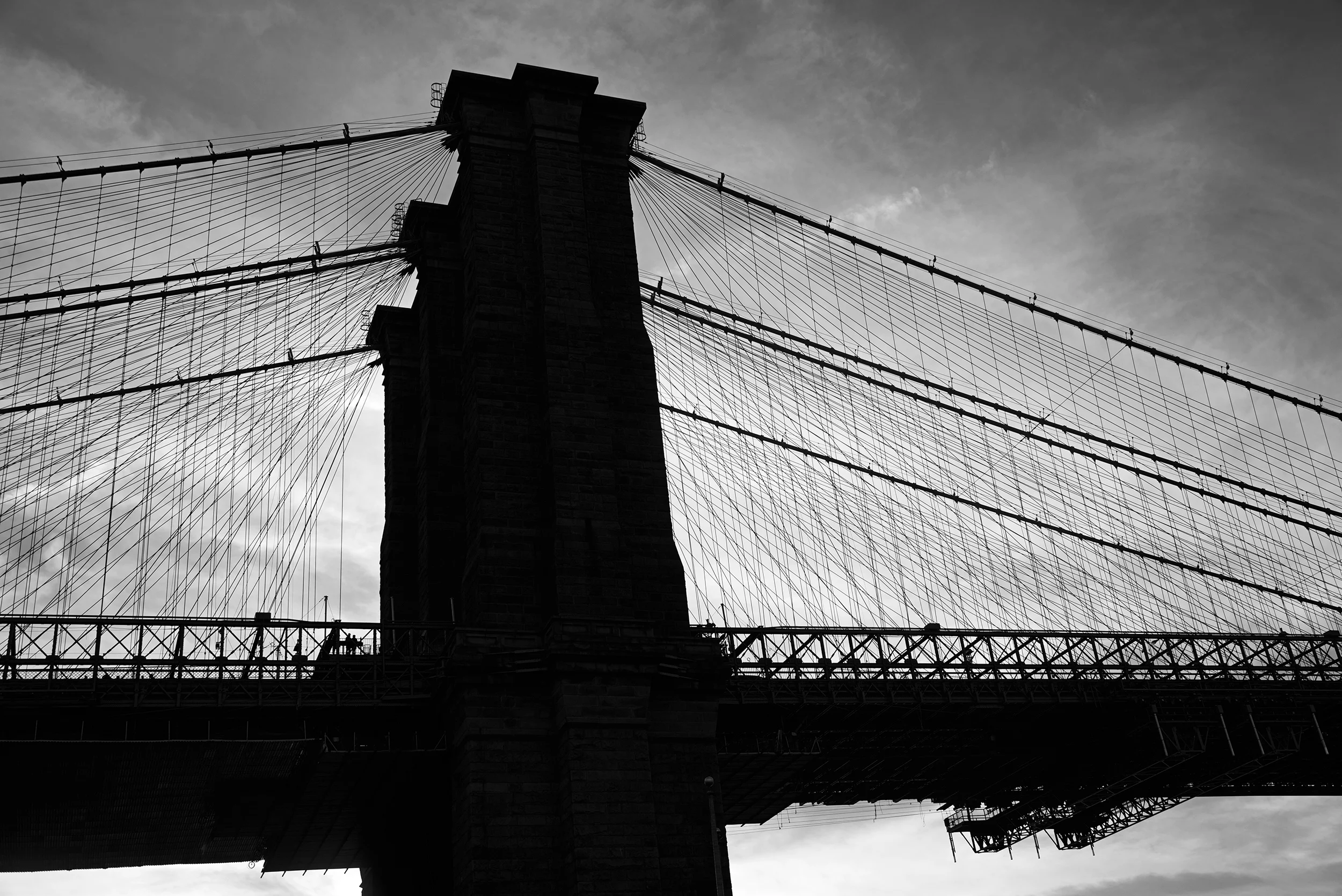 Silhouette of the Brooklyn Bridge at dusk, New York City